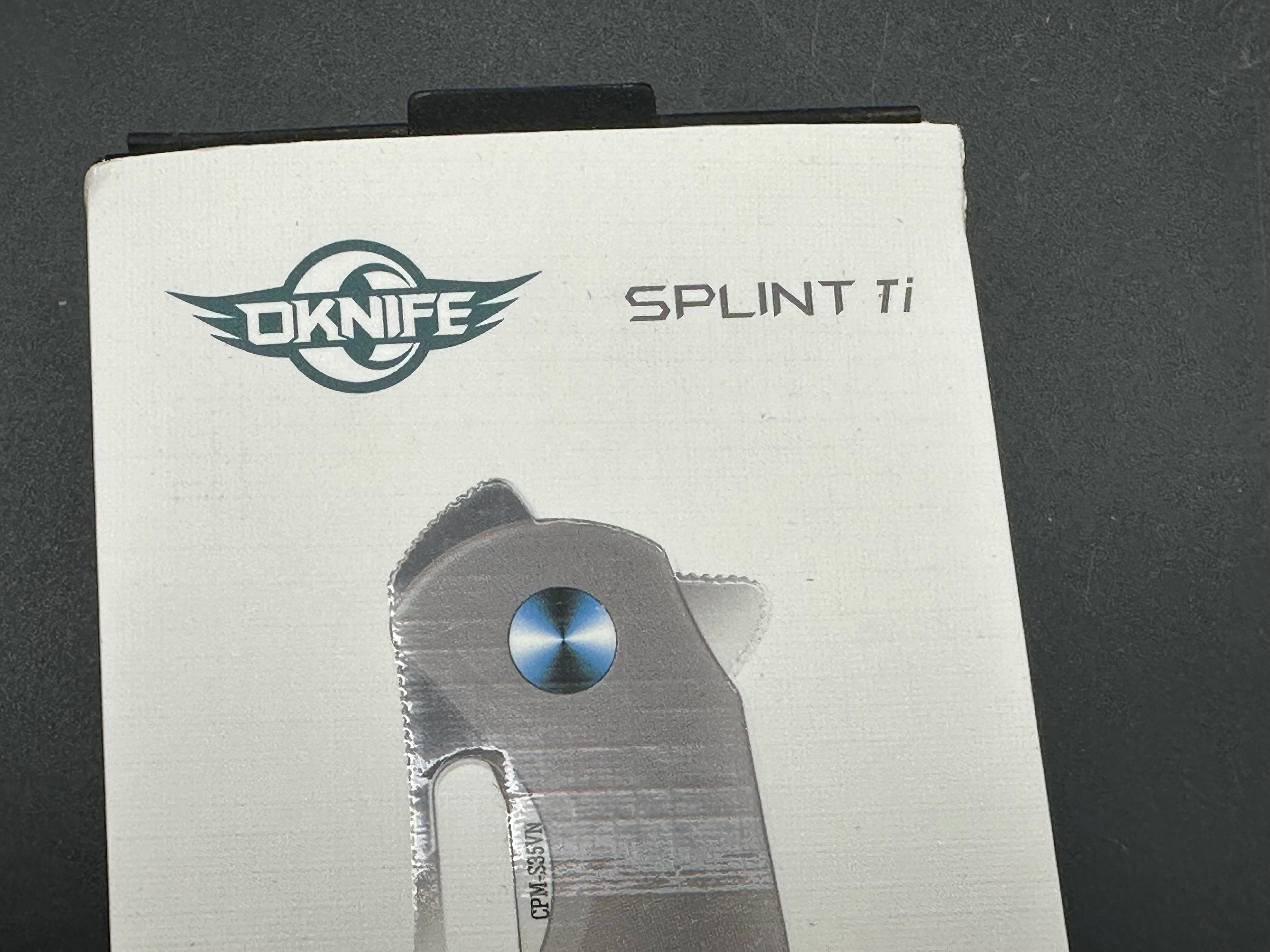 OLIGHT OKNIFE SPLINT FOLDING KNIFE TITANIUM HANDLE CMP-S35VN CLIP POINT PLAIN EDGE OLSPTI