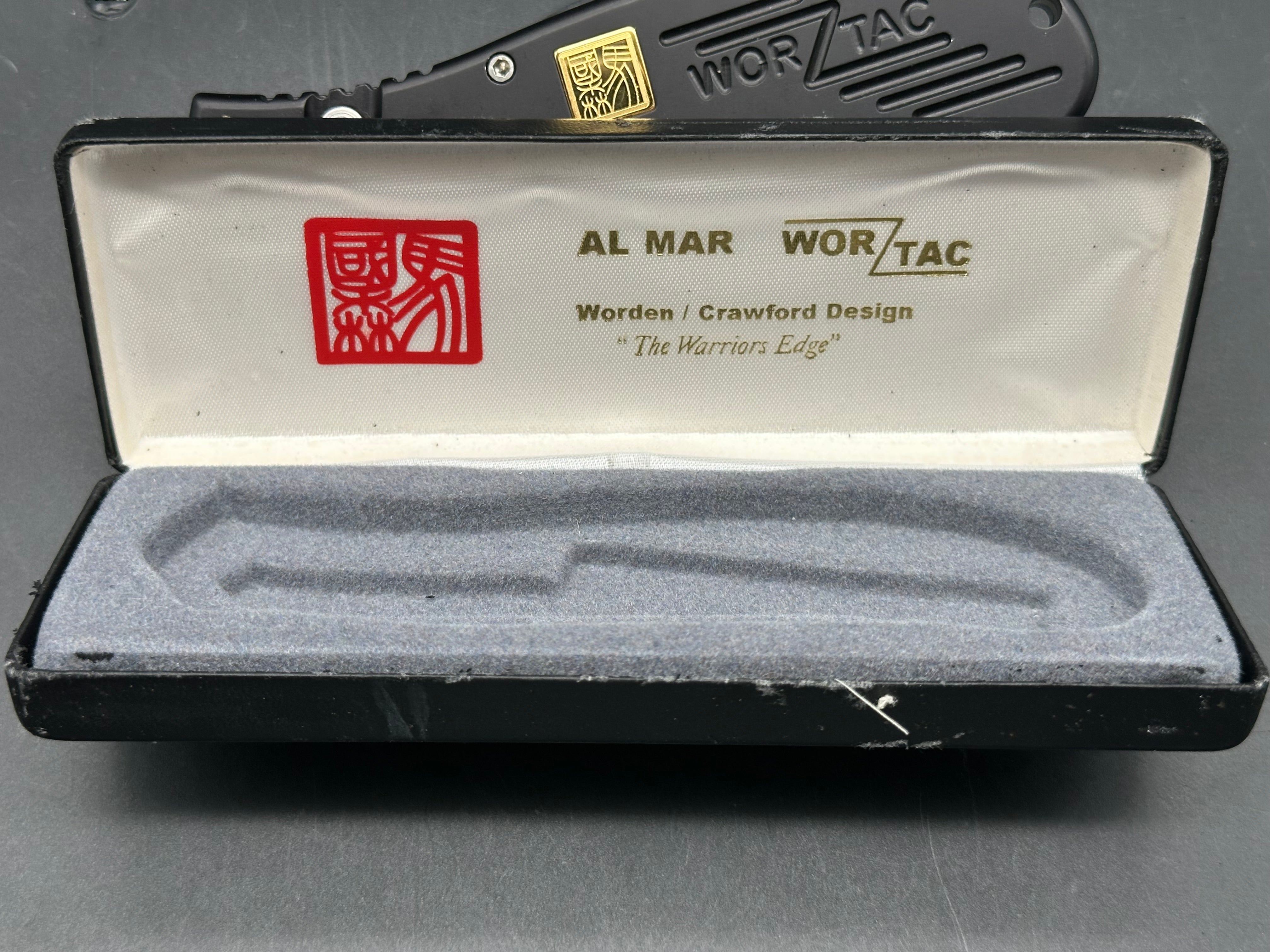 Al Mar Wor-Tac Auto knife was designed by Kelly Wordon and Pat  Crawford