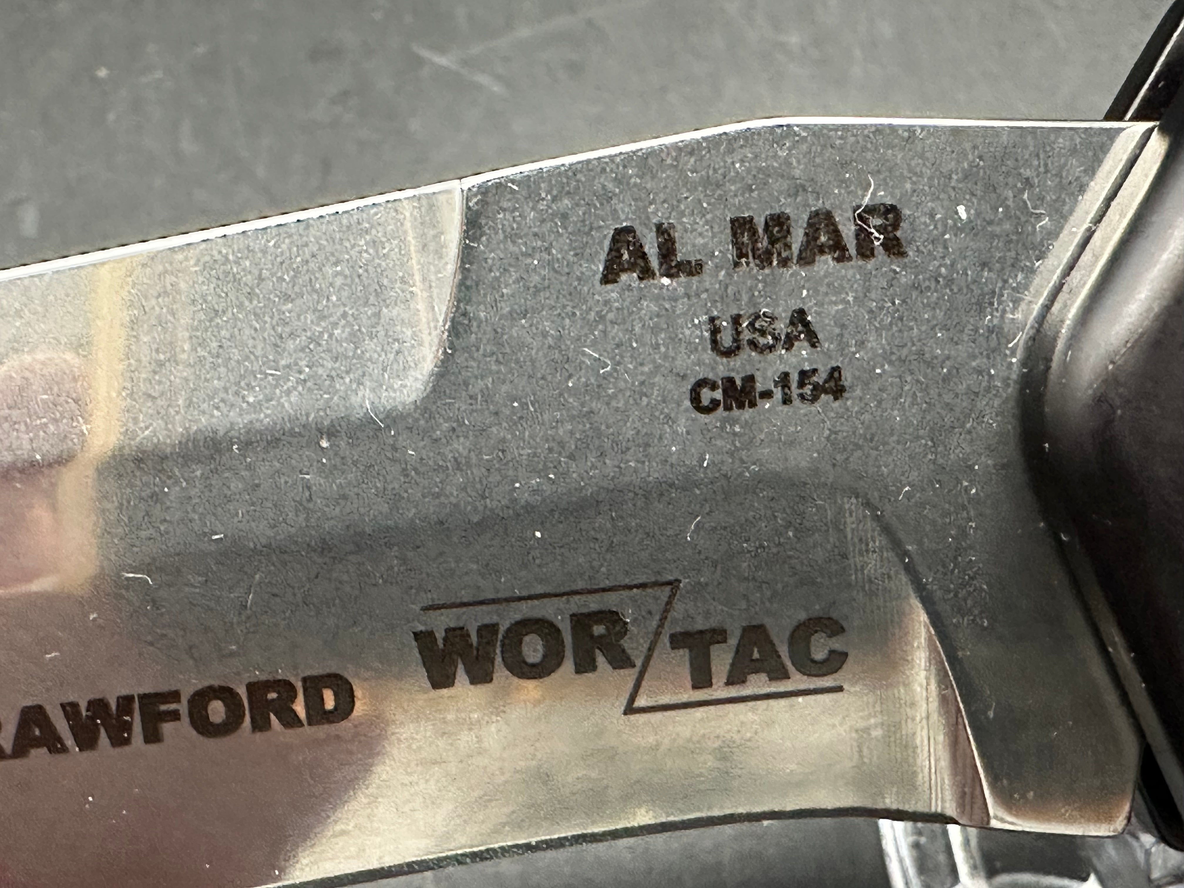 Al Mar Wor-Tac Auto knife was designed by Kelly Wordon and Pat  Crawford