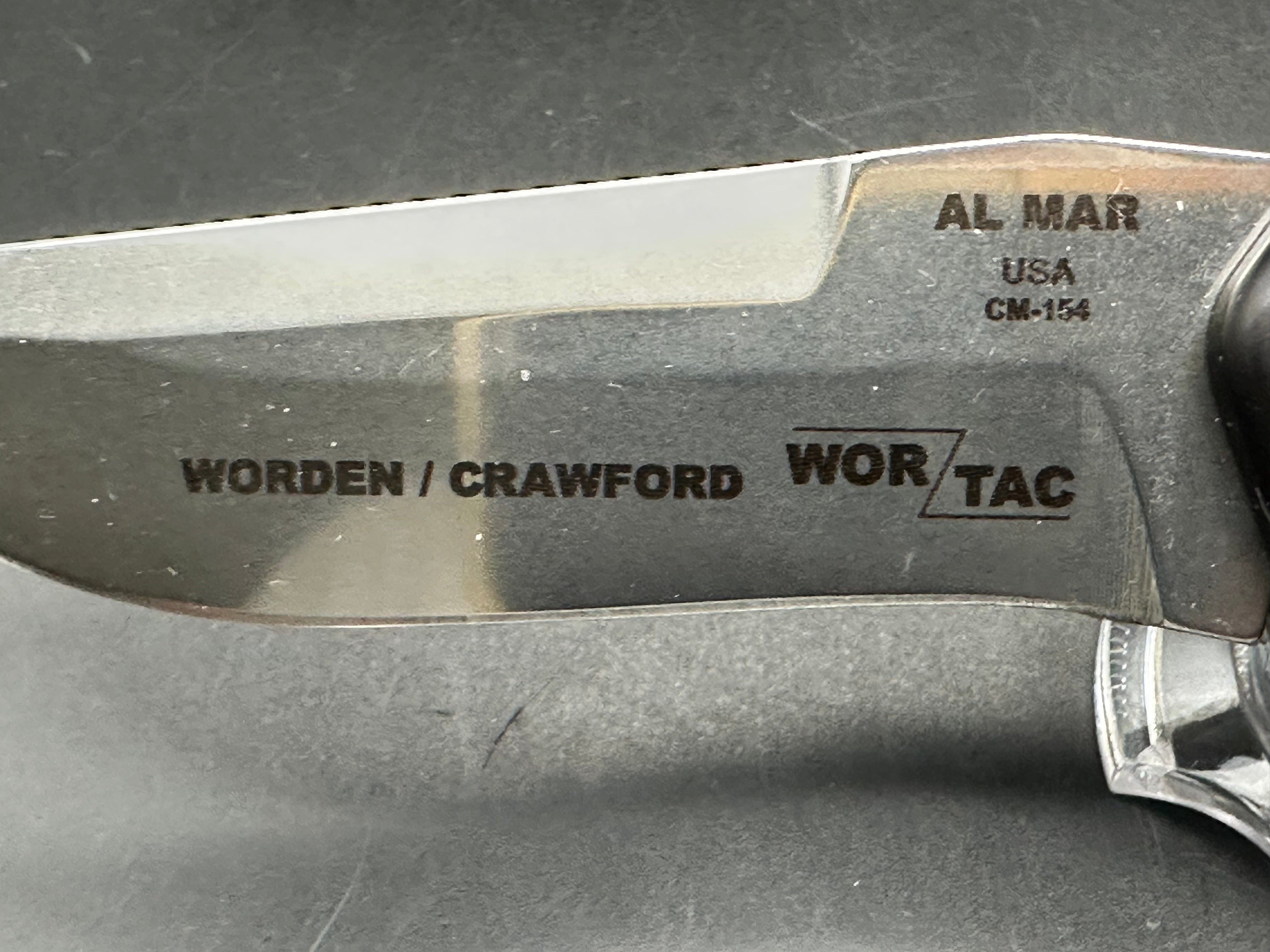 Al Mar Wor-Tac Auto knife was designed by Kelly Wordon and Pat  Crawford