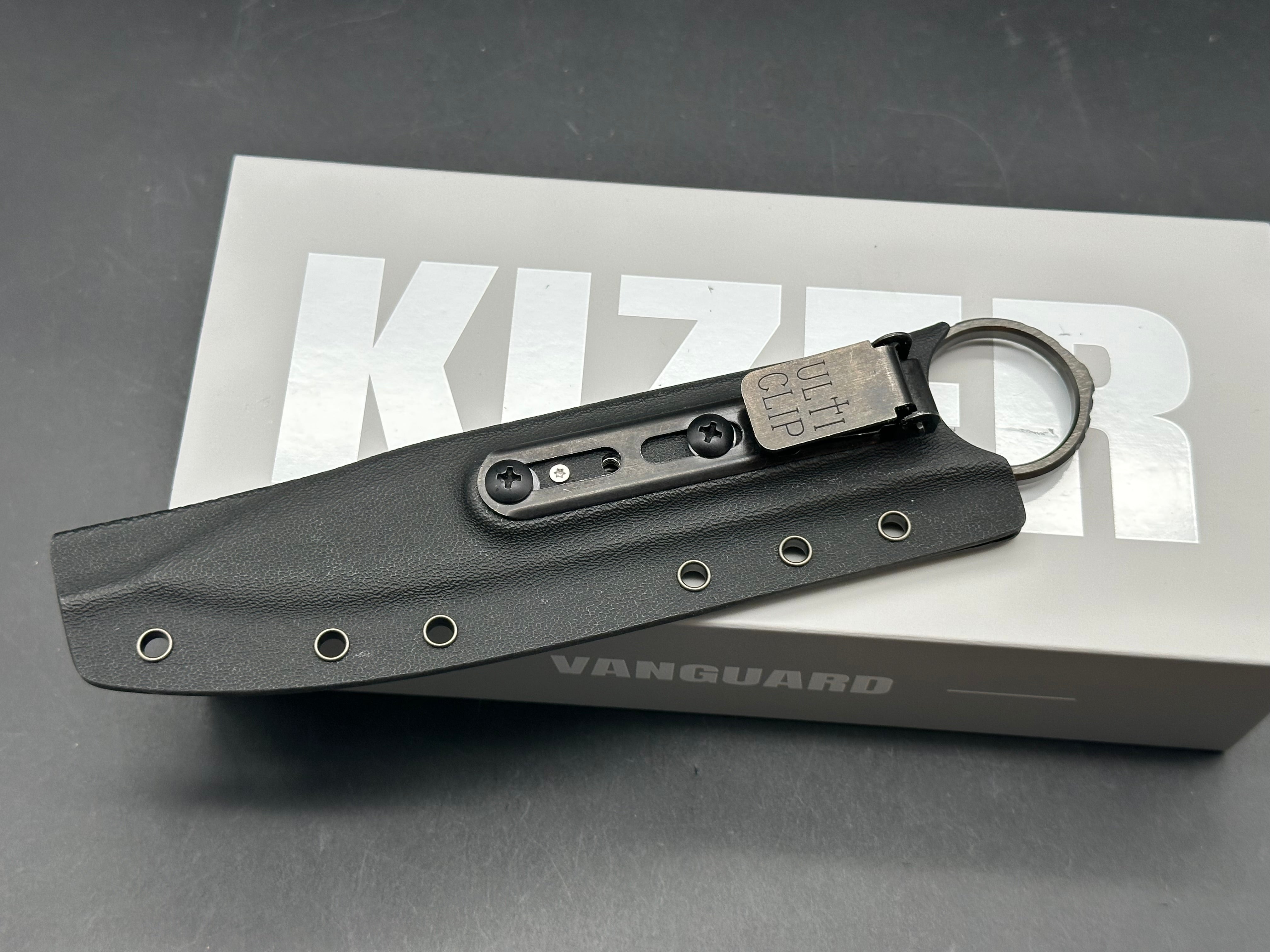 KIZER DEFENSOR M390 HANDLE/BLADE M390 SPEAR POINT PARTIALLY SERRATED EDGE