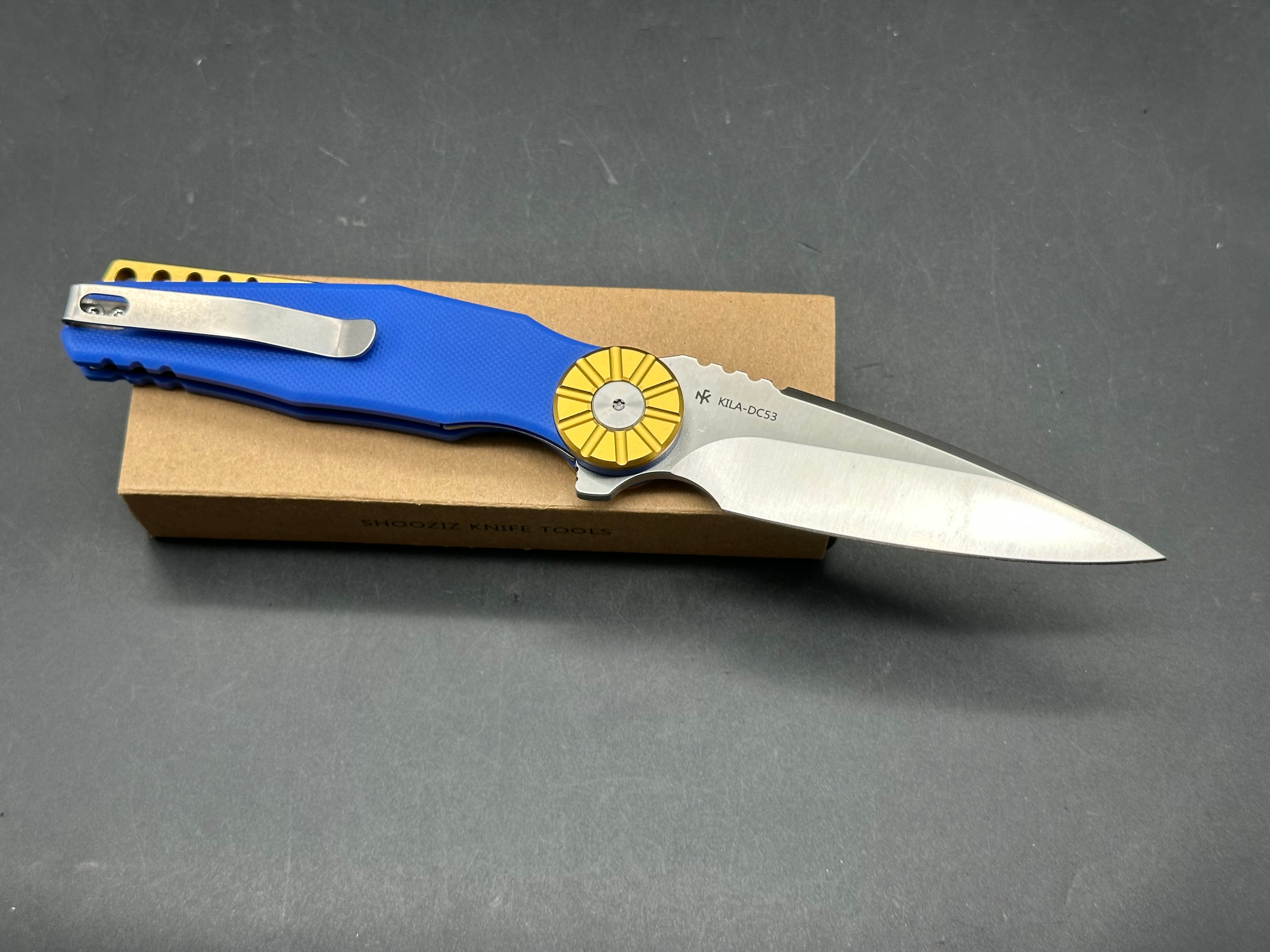 Shooziz Kila DC53 Steel, Aluminum Bolster, Blue G10 Handle
