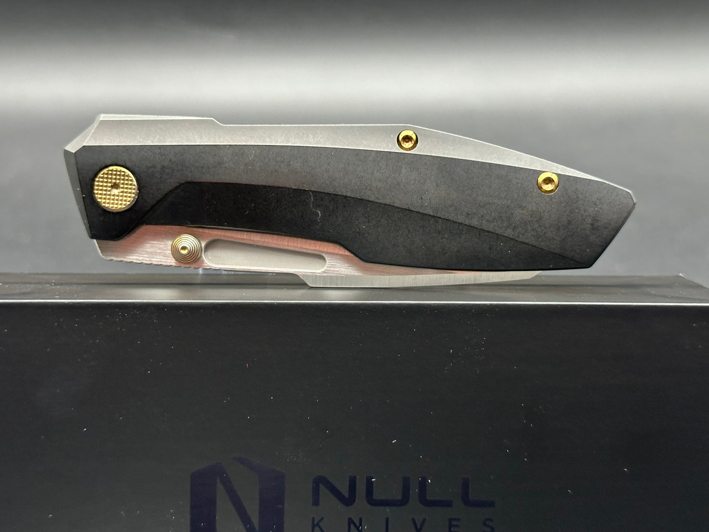 Null Knives Raikou w/black PVD titanium scales with gold hardware and a satin finished S90V blade