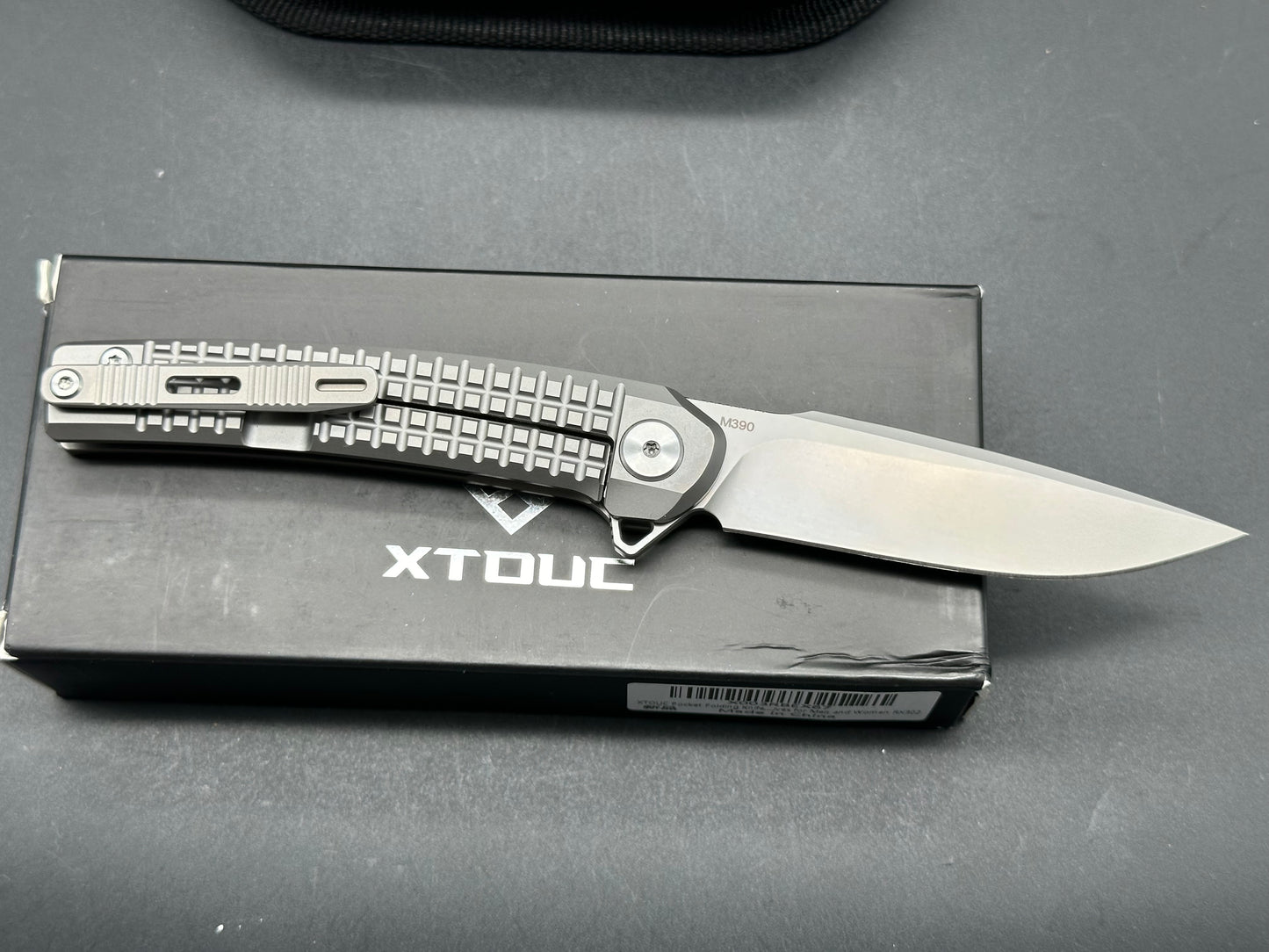 XTOUC RX302, 3.15" M390 Bead Basted Blade with Titanium Frag Handle