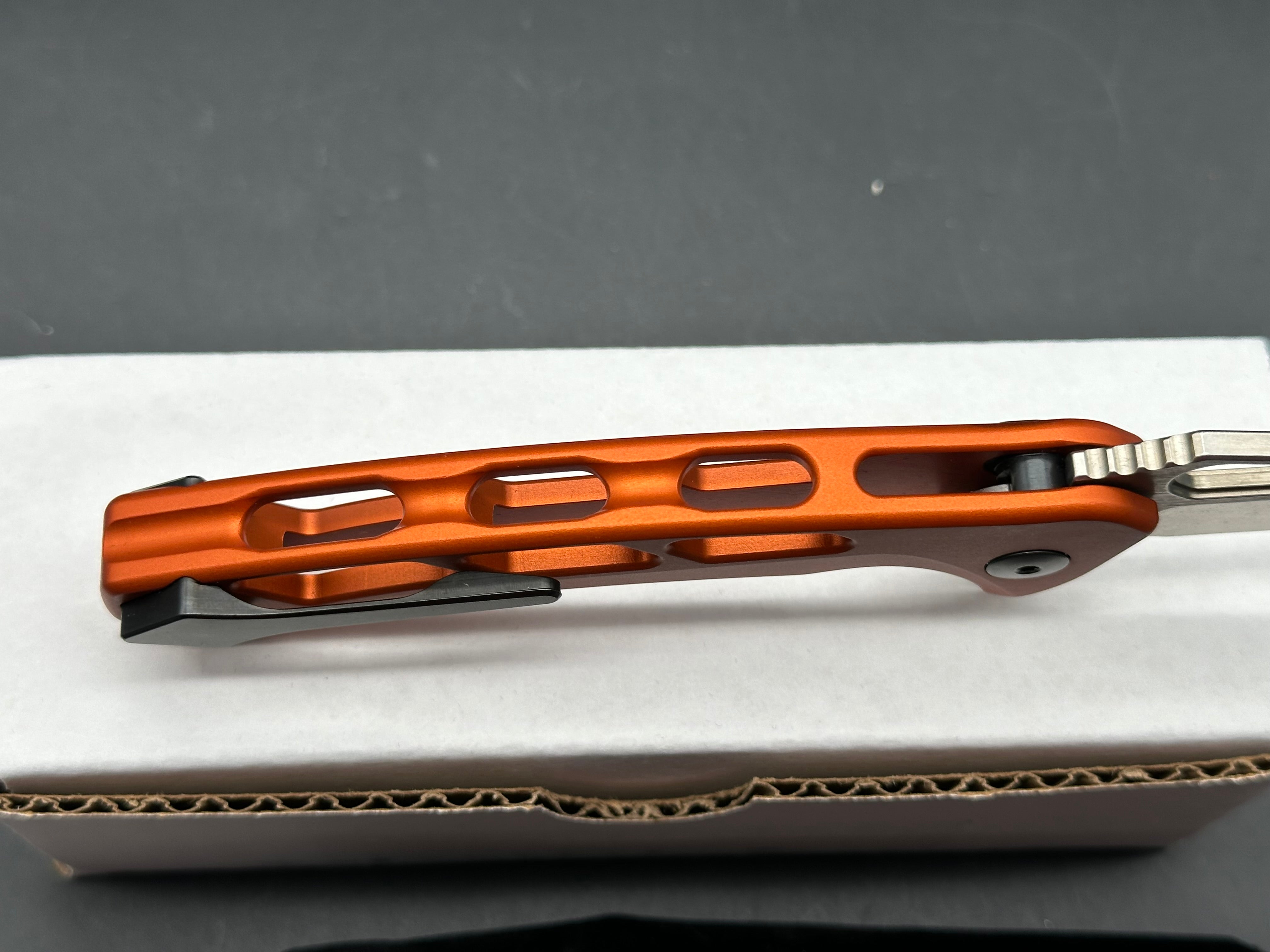 Dead Reckon Knives Ridgeback Integral Vertebrae, 3.42" CPM MagnaCut Stonewash Modified Clip Point Blade with Orange Integral Vertebrae Aluminum Scale