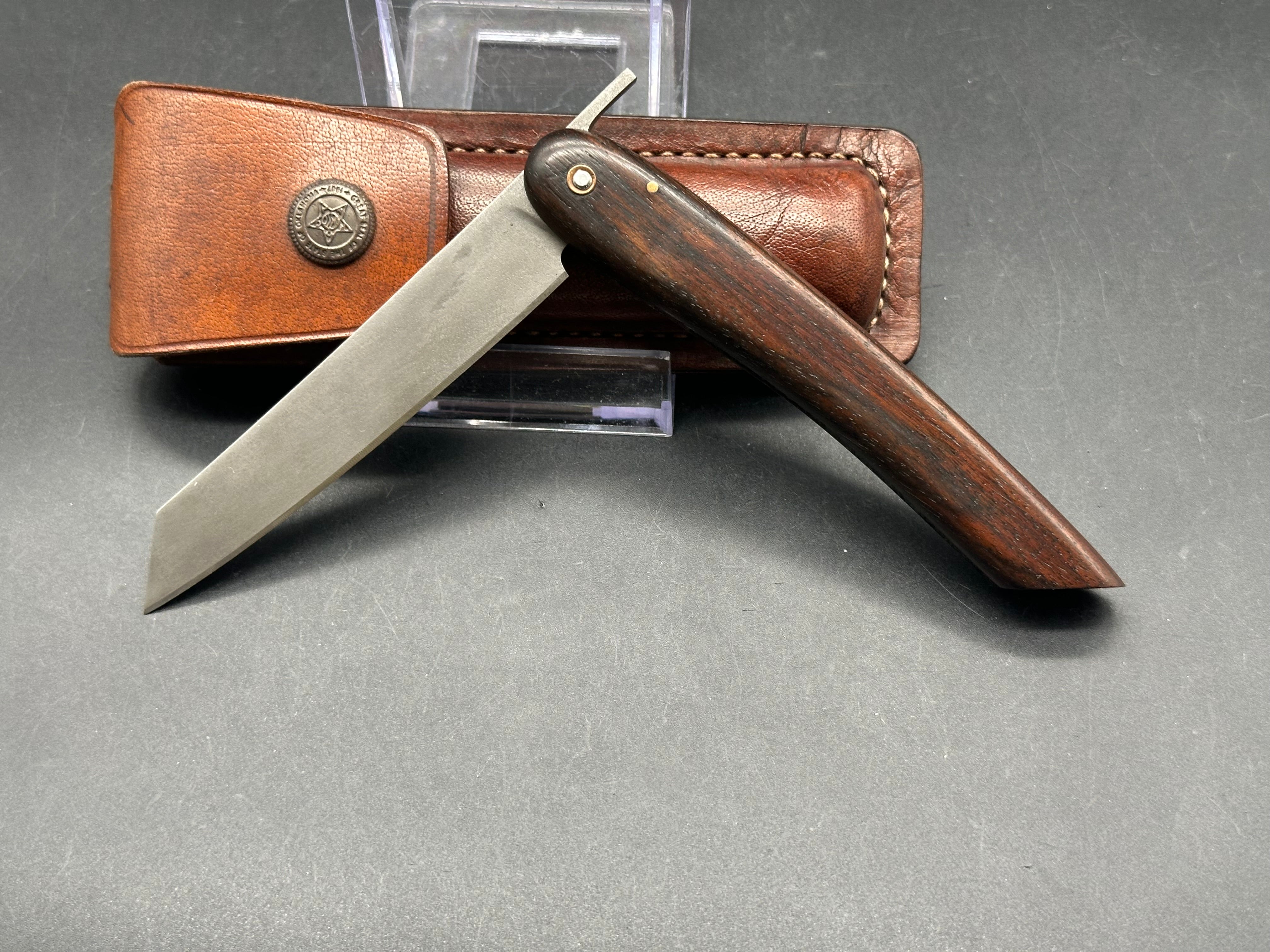 Younique Design “Friction Folder”  Rosewood handle w/Wootz crucible steel blade