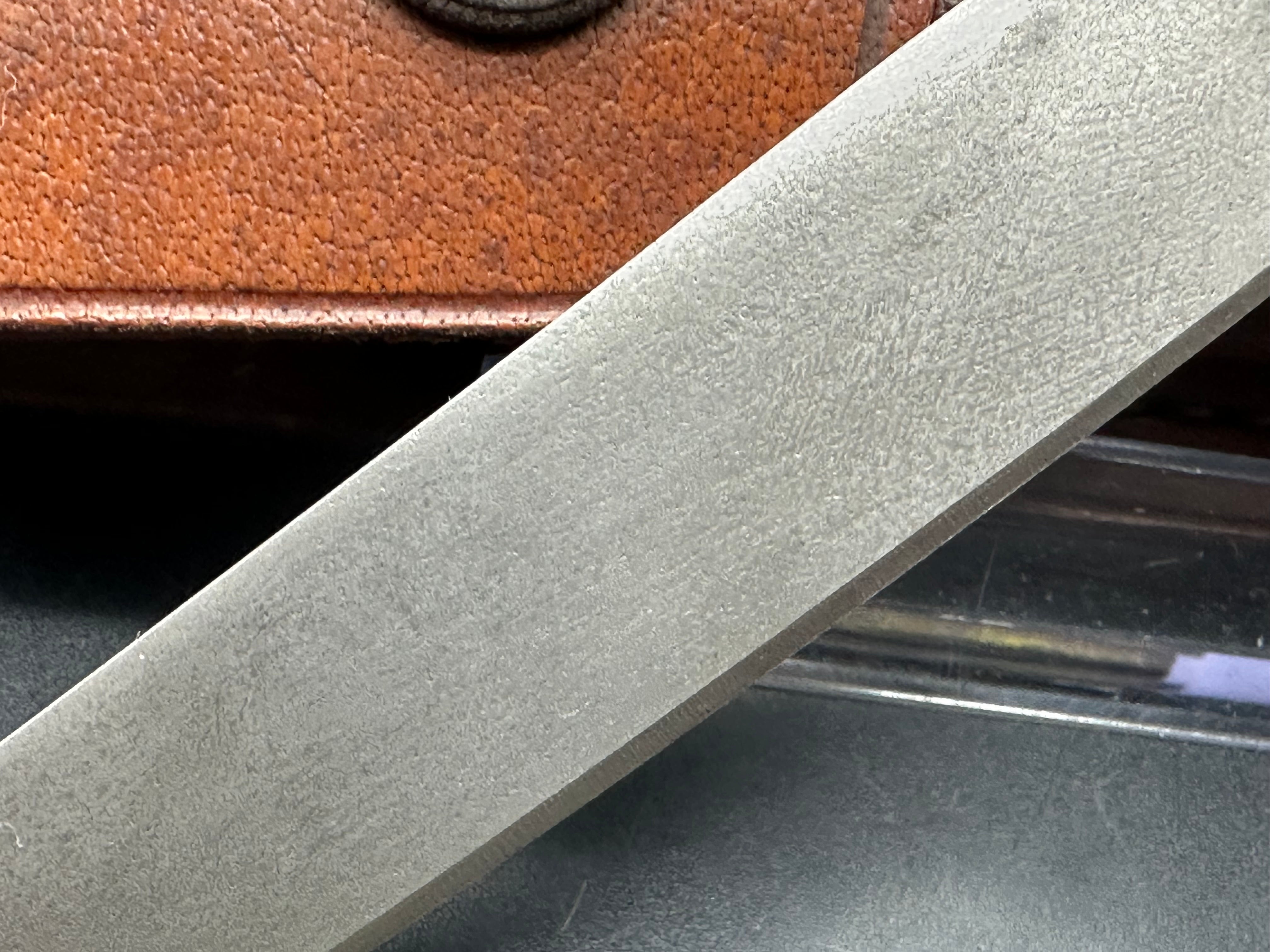 Younique Design “Friction Folder”  Rosewood handle w/Wootz crucible steel blade