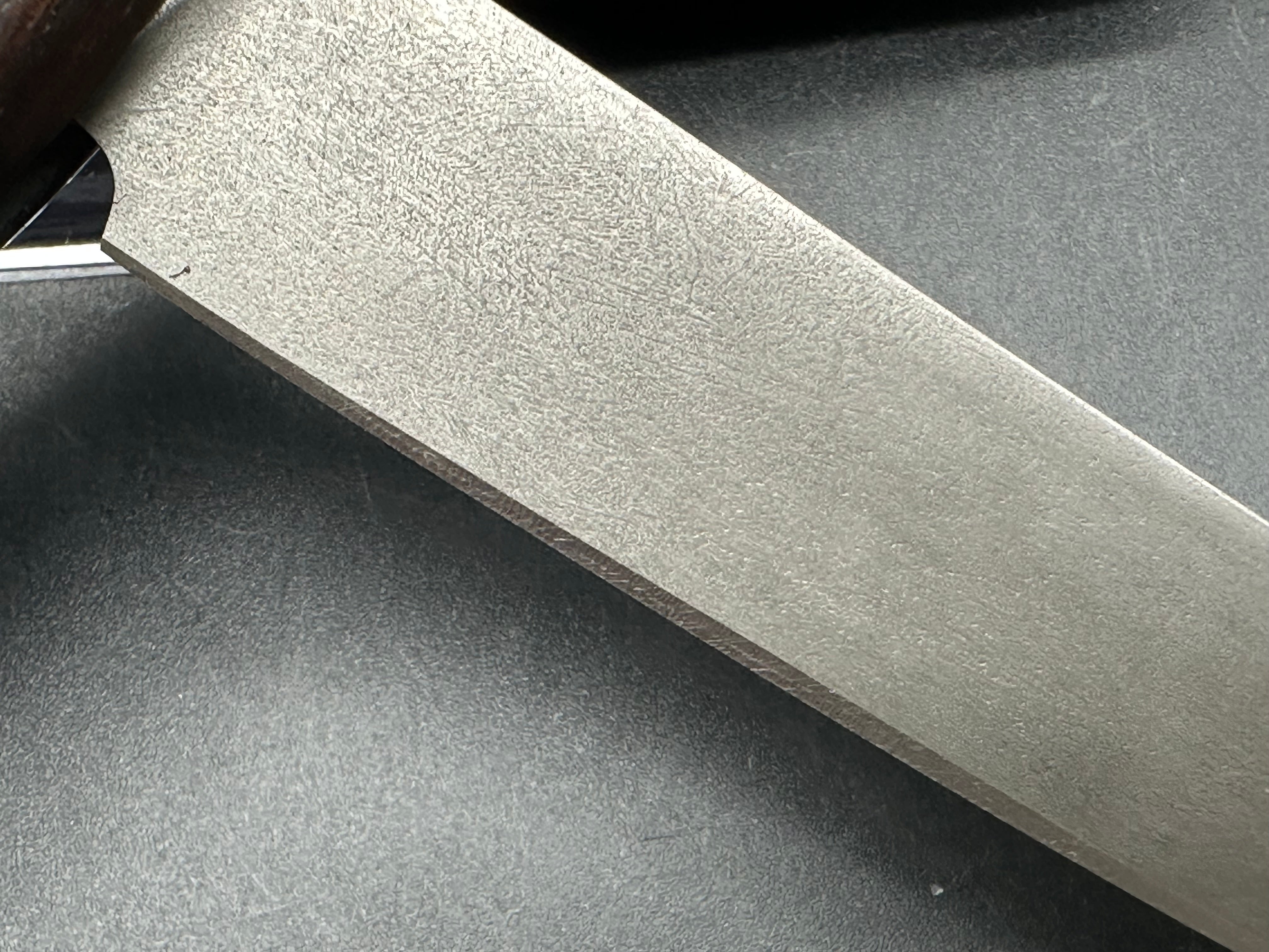 Younique Design “Friction Folder”  Rosewood handle w/Wootz crucible steel blade