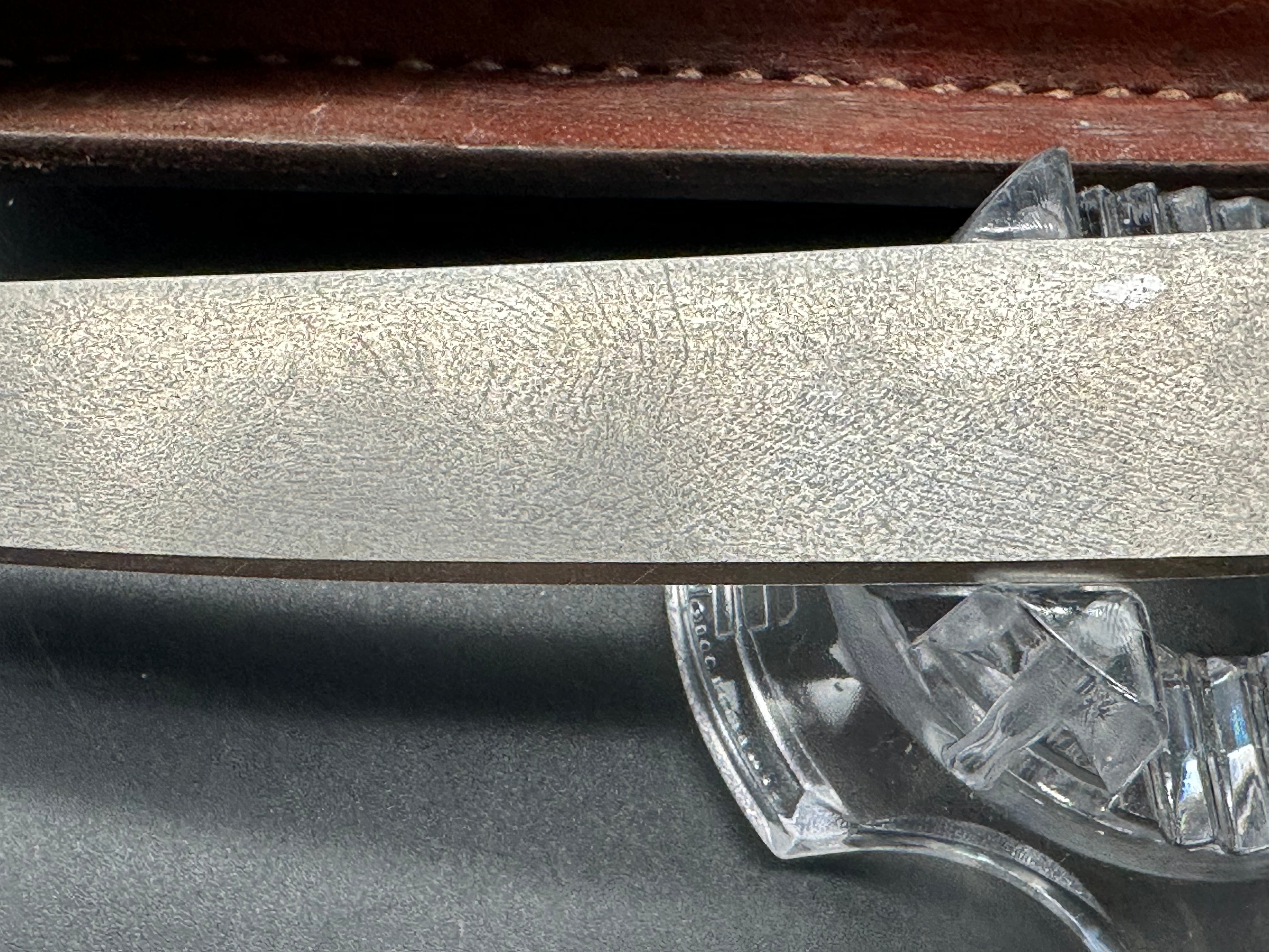 Younique Design “Friction Folder”  Rosewood handle w/Wootz crucible steel blade