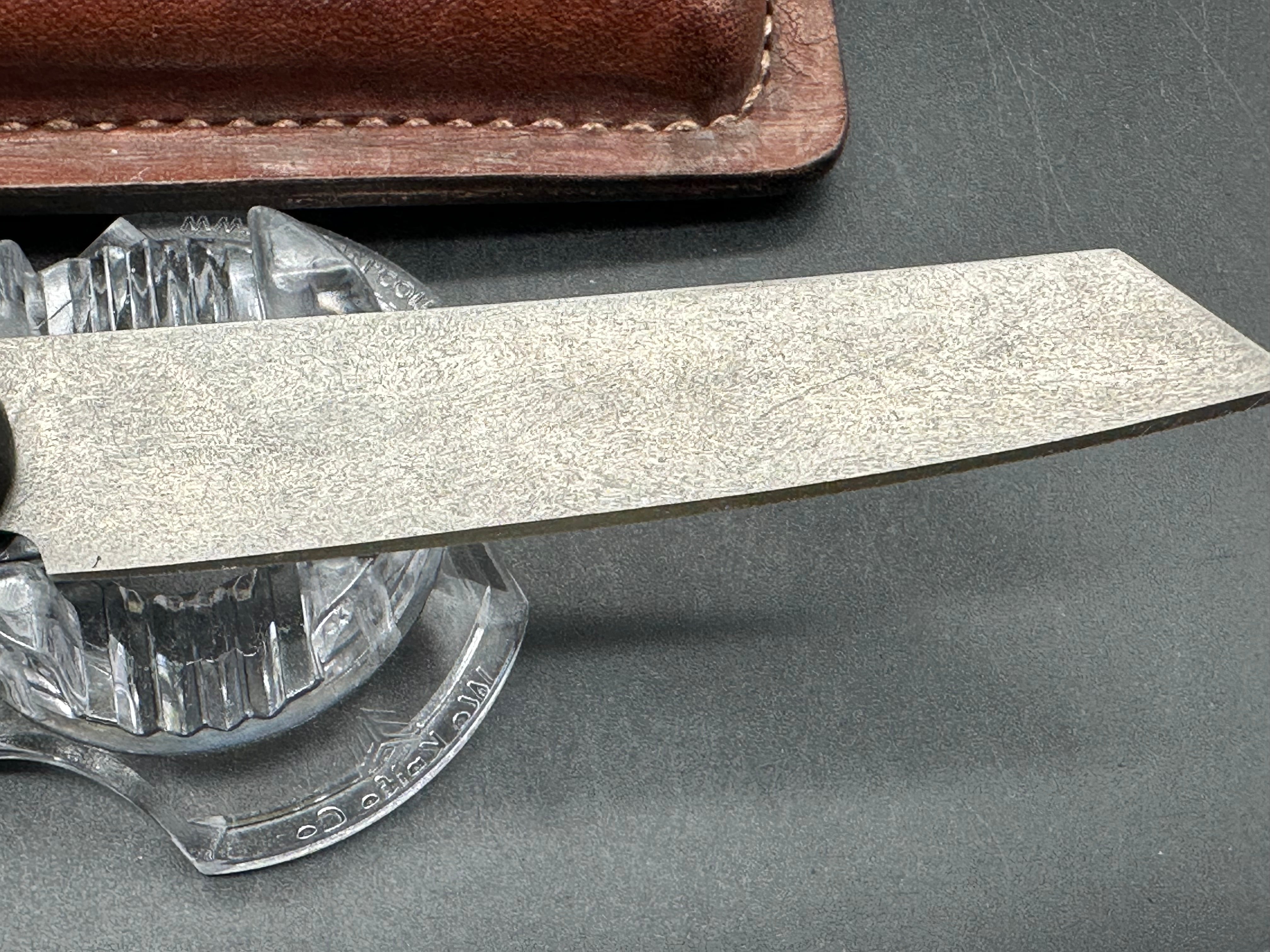 Younique Design “Friction Folder”  Rosewood handle w/Wootz crucible steel blade