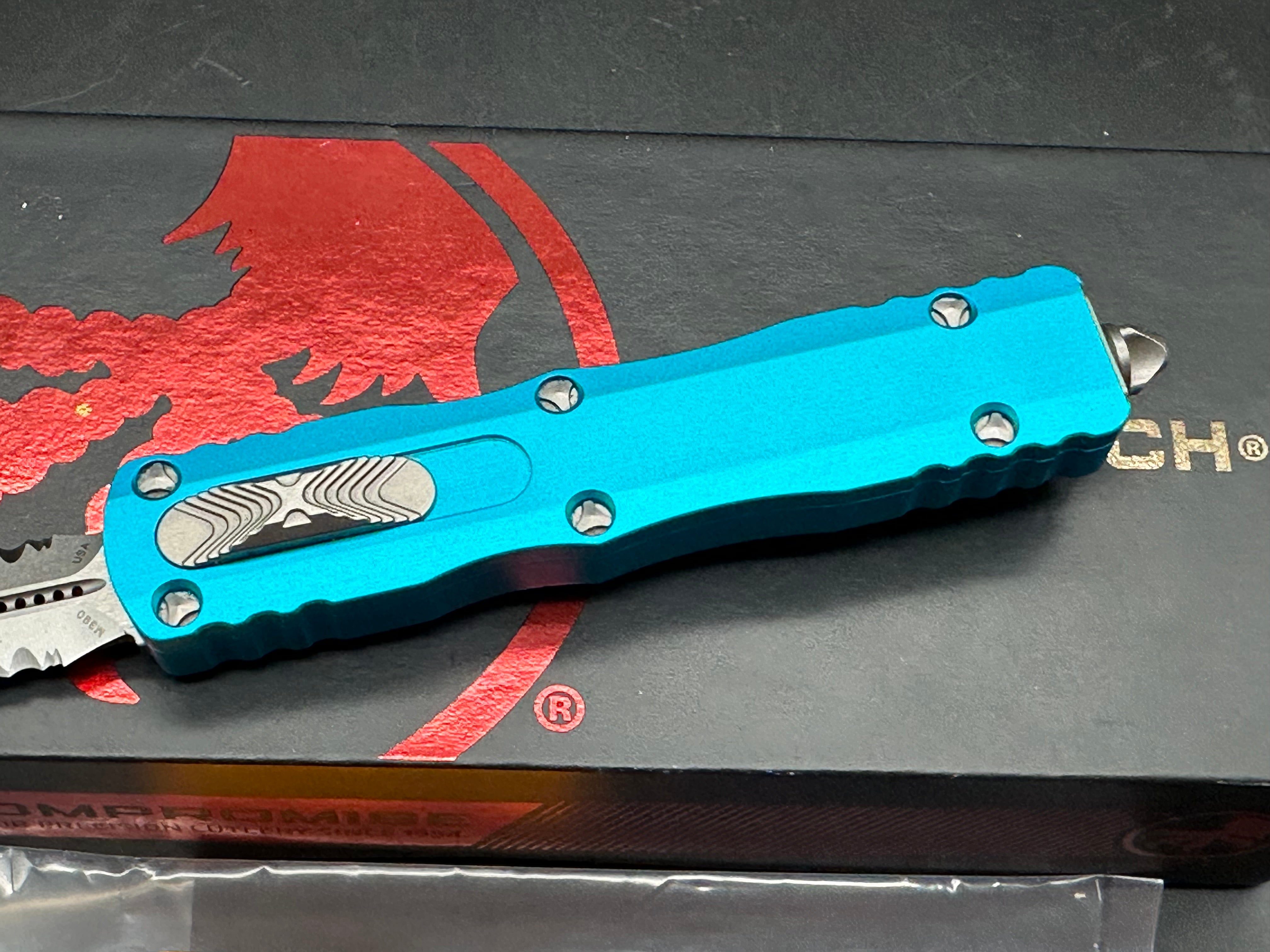 Microtech 225-11TQ Dirac AUTO OTF Knife 2.92" Stonewashed Double Combo Edge Dagger Blade, Turquoise Aluminum Handles