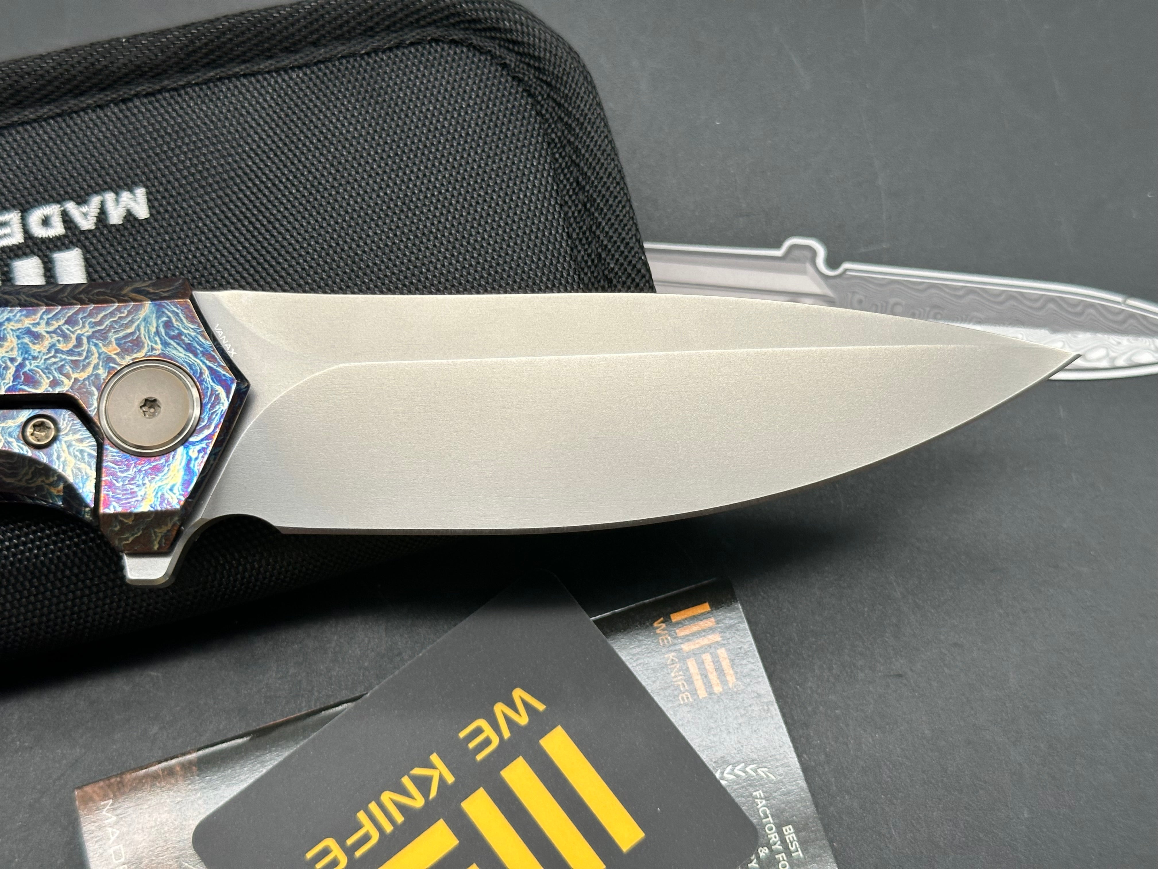 WE ACUMINAL FOLDING KNIFE FLAMED TITANIUM HANDLE VANAX PLAIN EDGE POLISHED BEAD BLAST FINISH