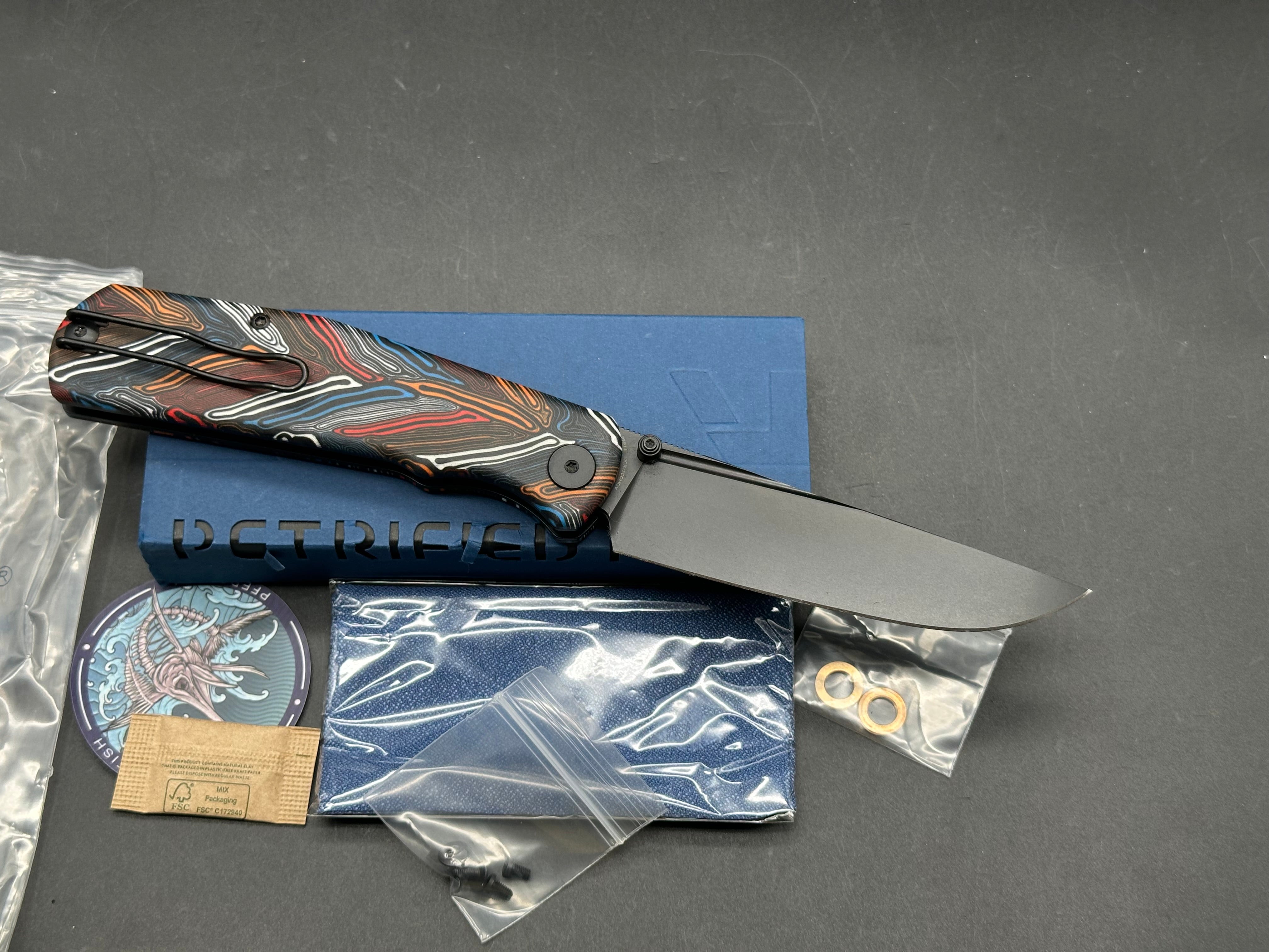 PETRIFIED FISH LIS FOLDING KNIFE BUTTON MULTI COLOR HANDLE 10CR15COMOV BLACK BLADE