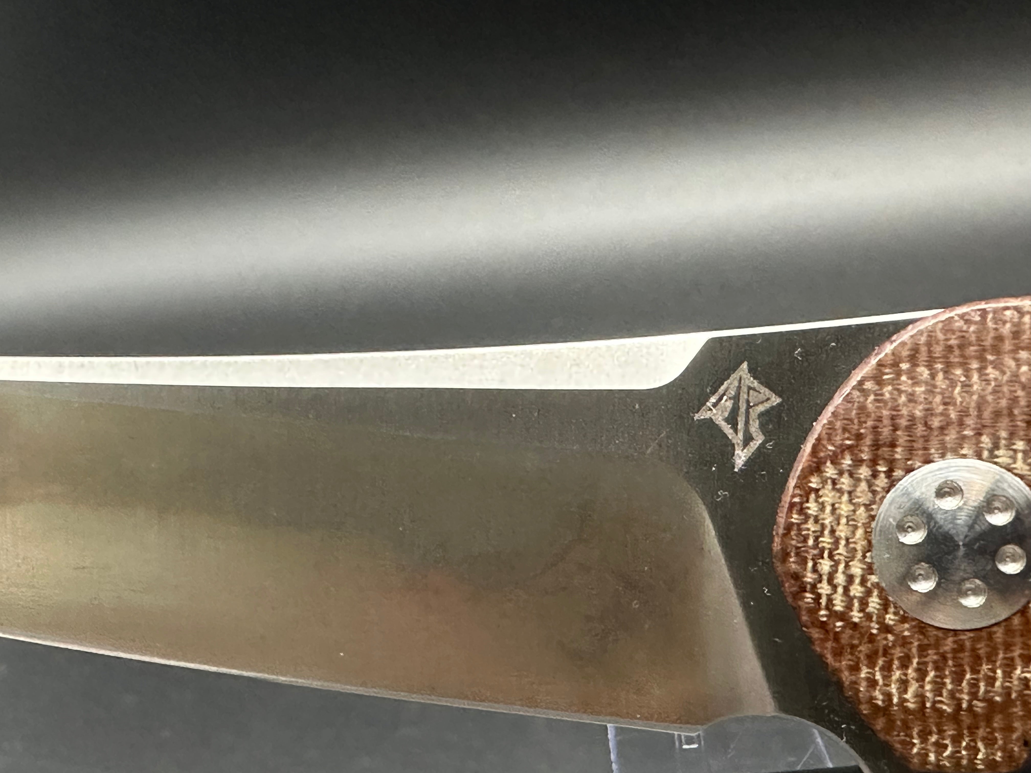 A Purvis Progeny MR micarta & 154CM blade