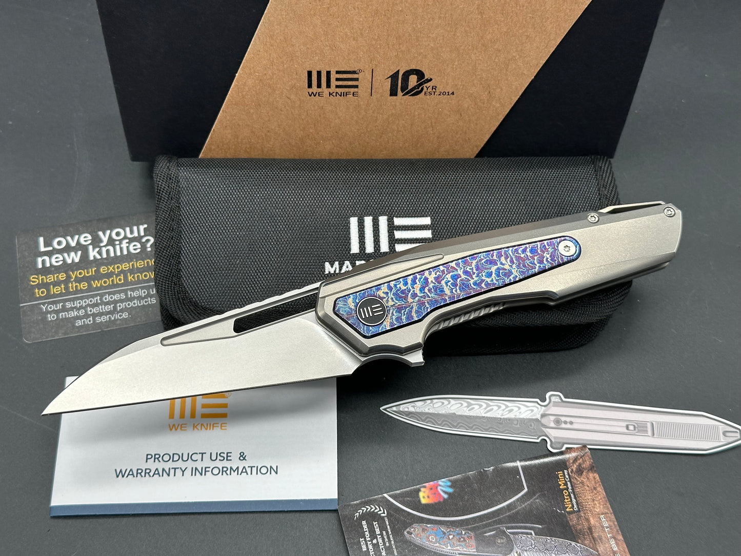 We Knives Maciej Torbe Falcaria Titanium Handle Lightning Ano Inlays CPM-20CV