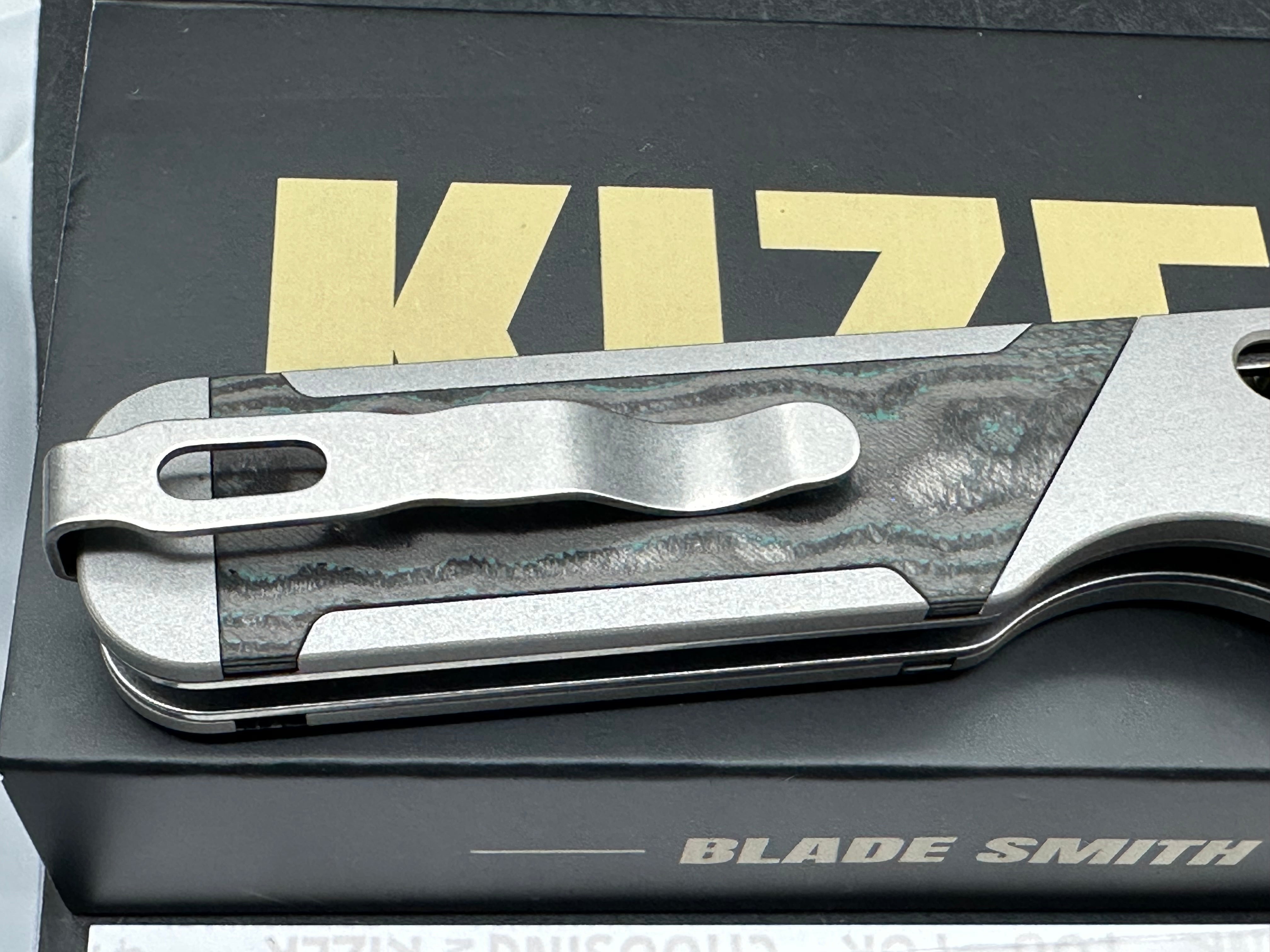 KIZER MILITAW 315 ALUMINUM/SHIPWRECK CAMOCARBON HANDLE ELMAX DROP POINT PLAIN EDGE