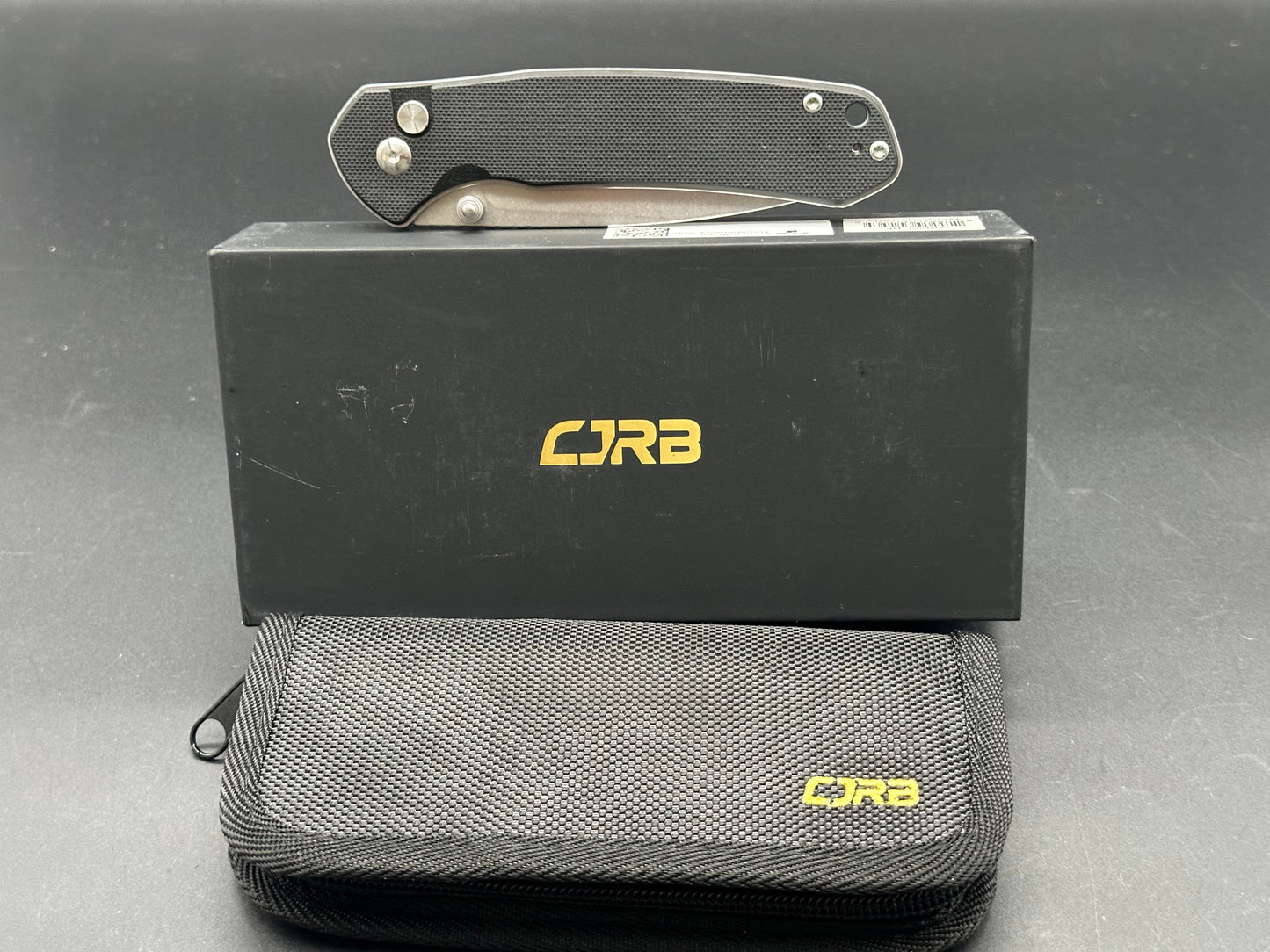CJRB Cutlery Large Pyrite Button Lock Knife Black G-10
