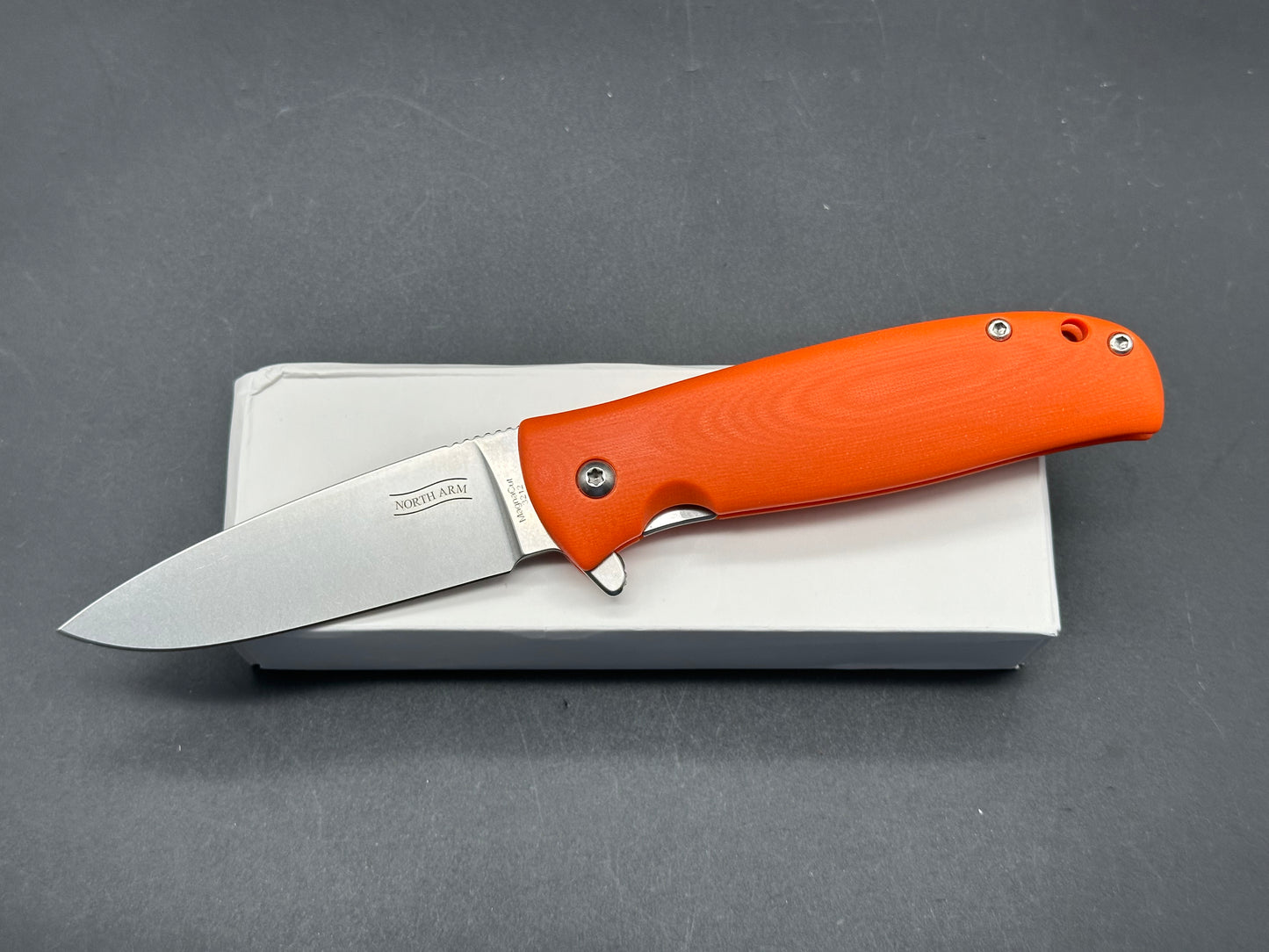 North Arm Skaha 2, 3.3" MagnaCut Blade with Orange G10 Handle (Serial #3212)