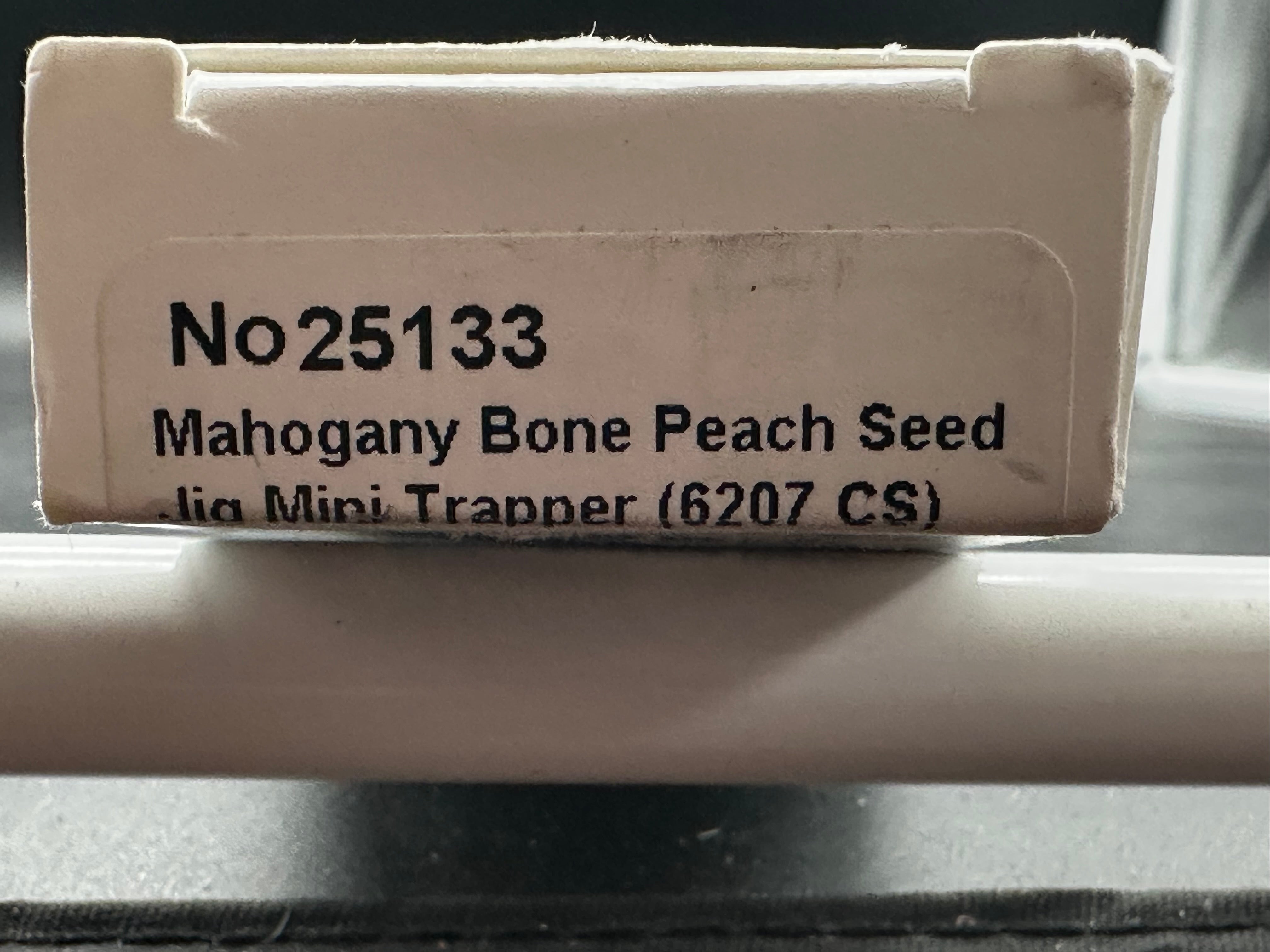 Case Mini Trapper mahogany bone peach seed milling on bone