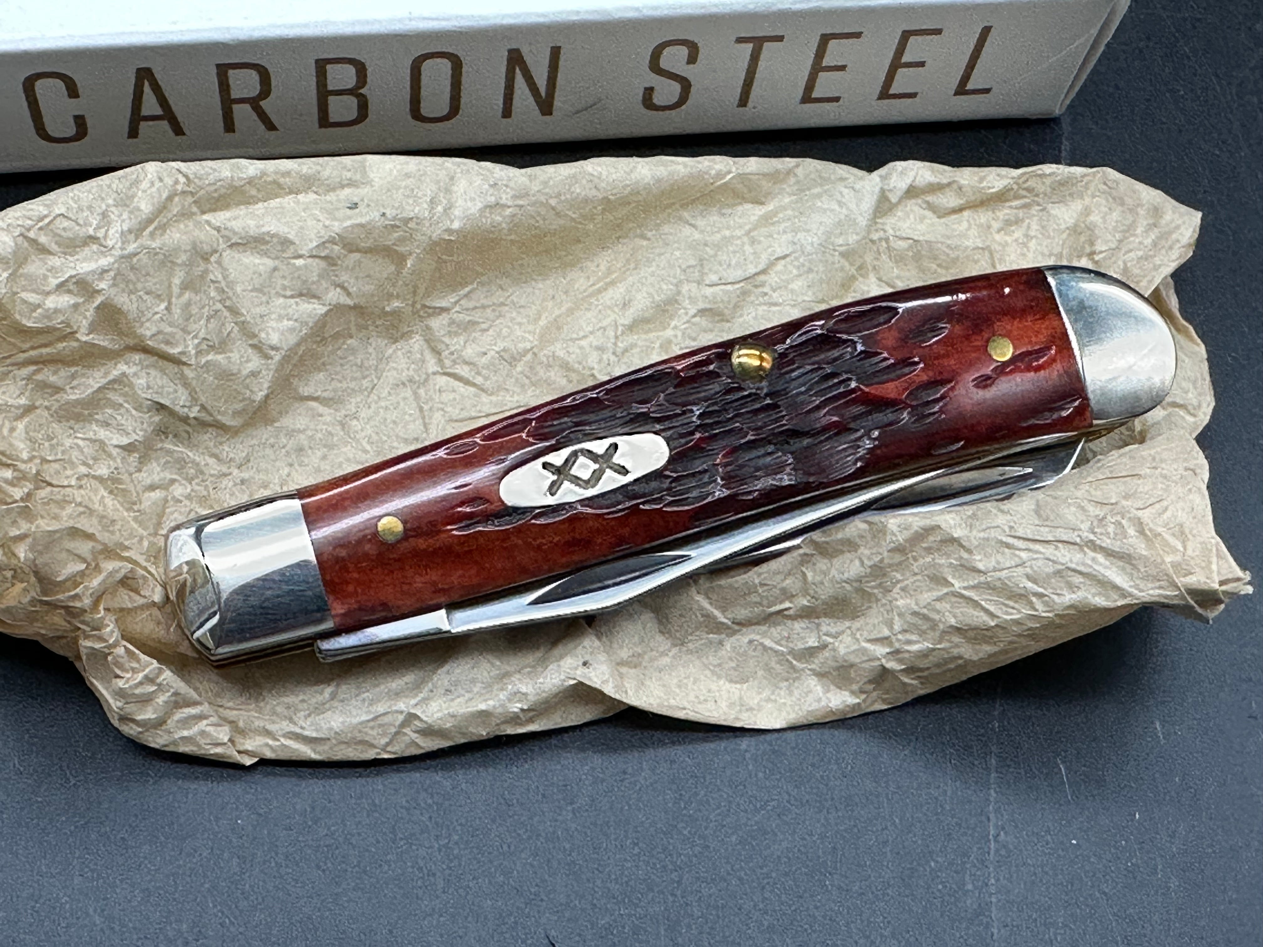 Case Mini Trapper mahogany bone peach seed milling on bone