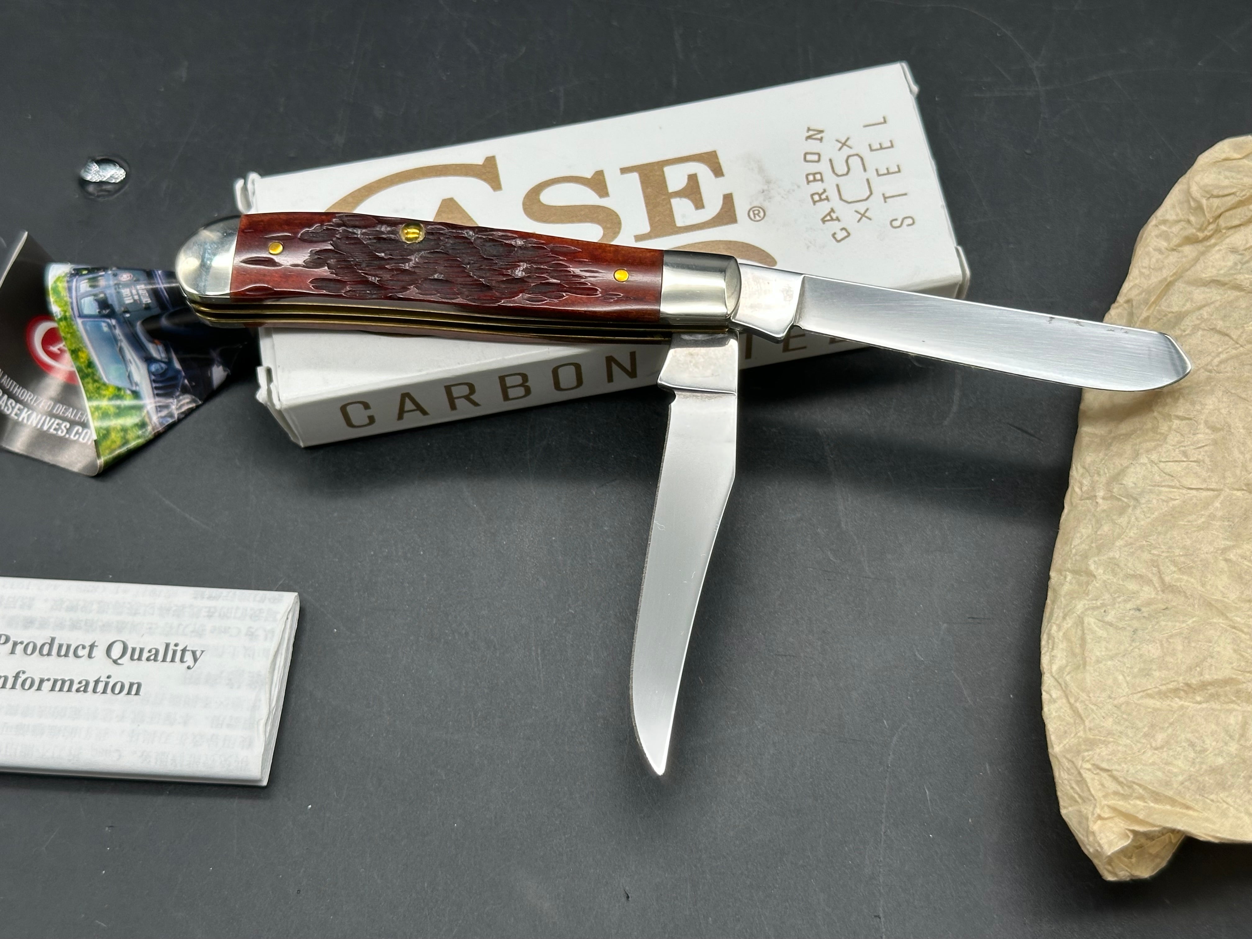 Case Mini Trapper mahogany bone peach seed milling on bone