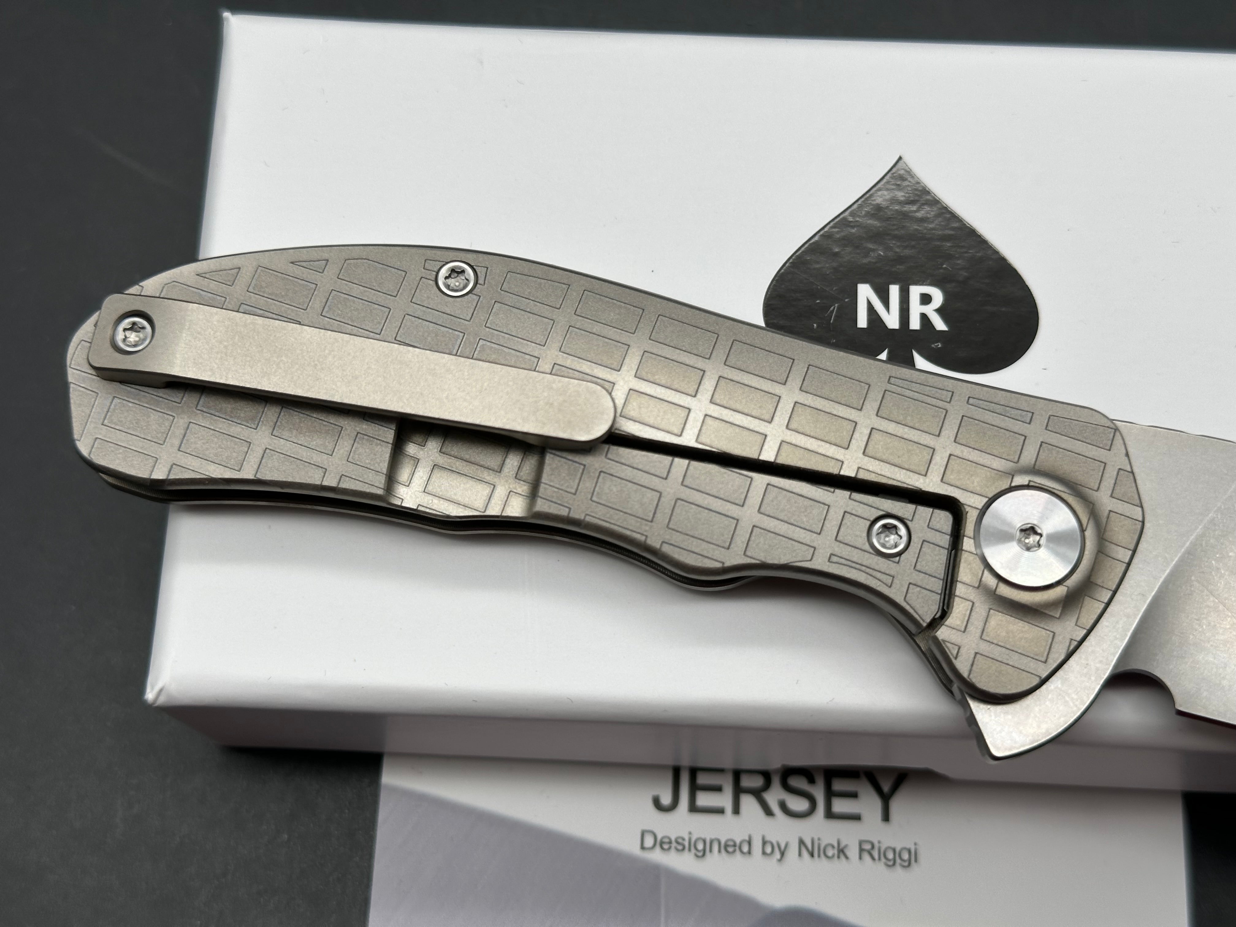 NRiggi Knives "JERSEY" Laser Engraved Titanium Scales w/CPM 20CV stonewash blade (brick pattern)