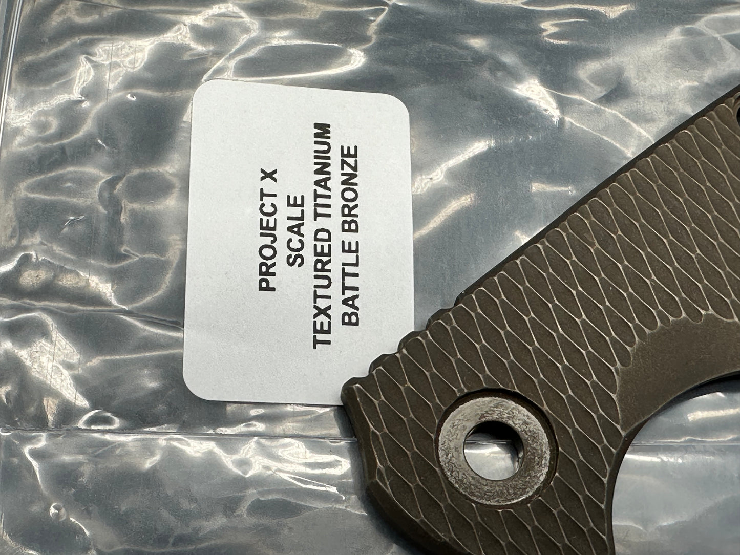 Hinderer Project X battle bronze titanium scale