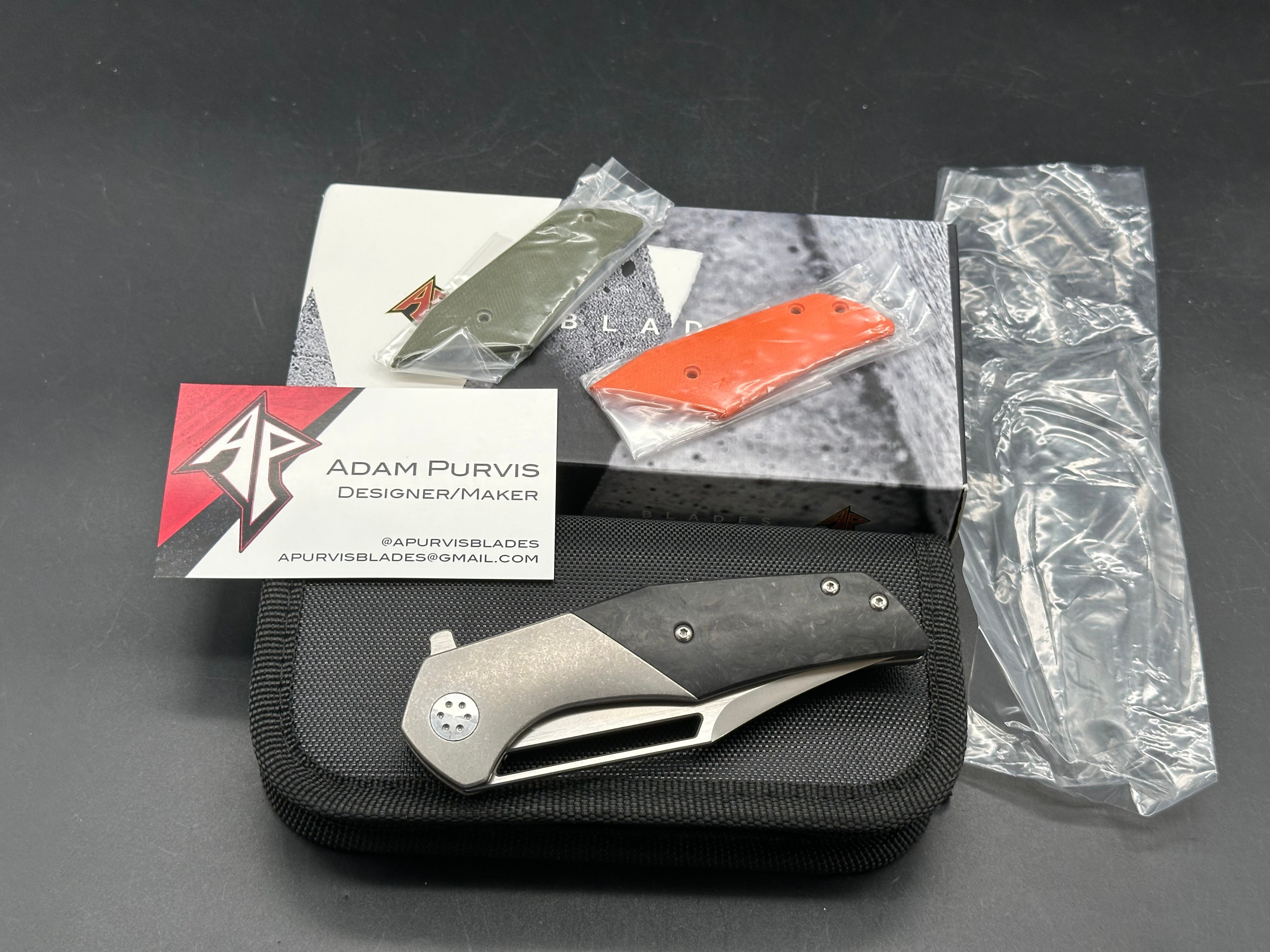 A. Purvis Blades Primordial MK2, Stonewashed M390 Blade Titanium Handles with Marbled Carbon Fiber Overlays