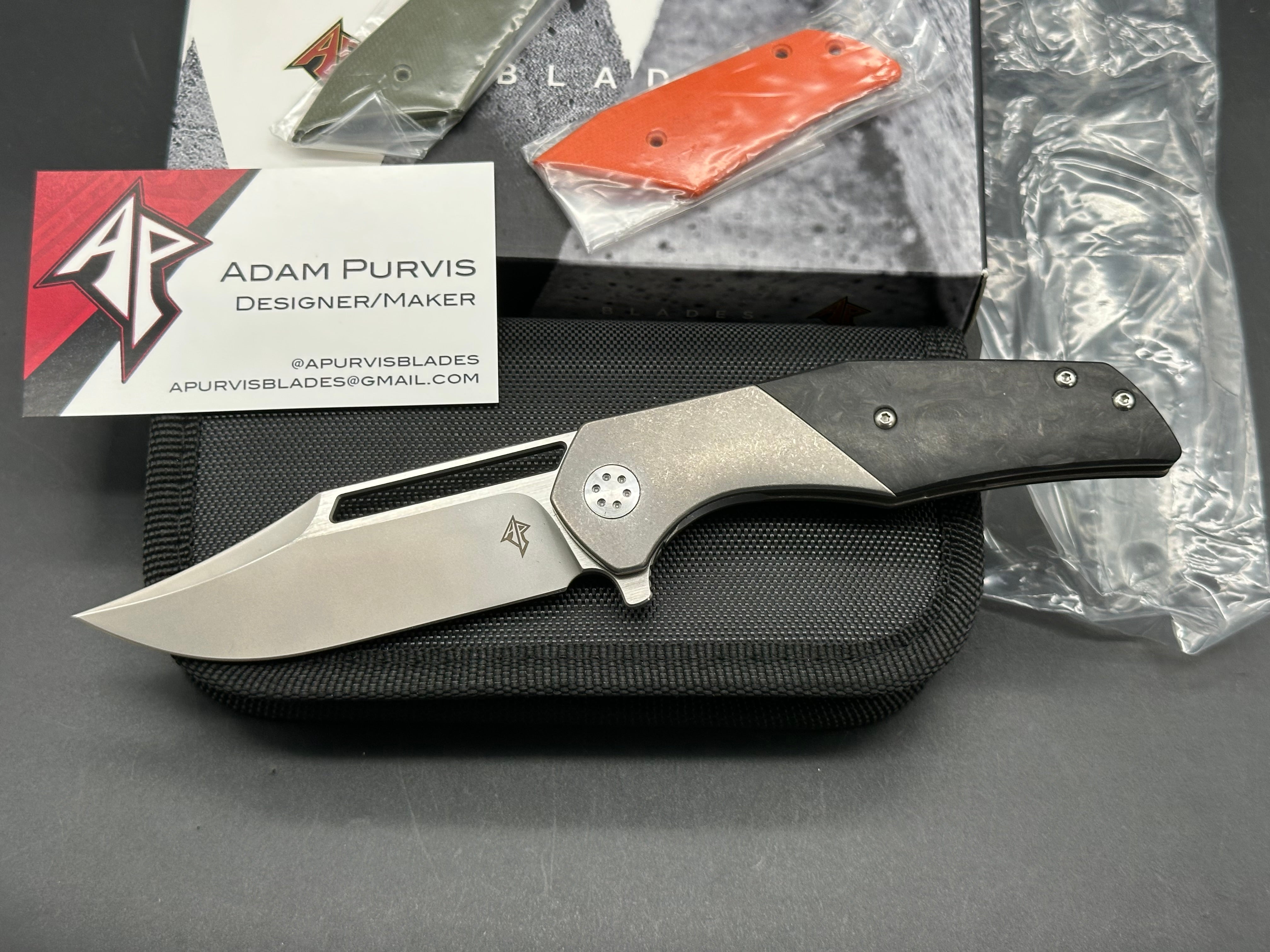 A. Purvis Blades Primordial MK2, Stonewashed M390 Blade Titanium Handles with Marbled Carbon Fiber Overlays