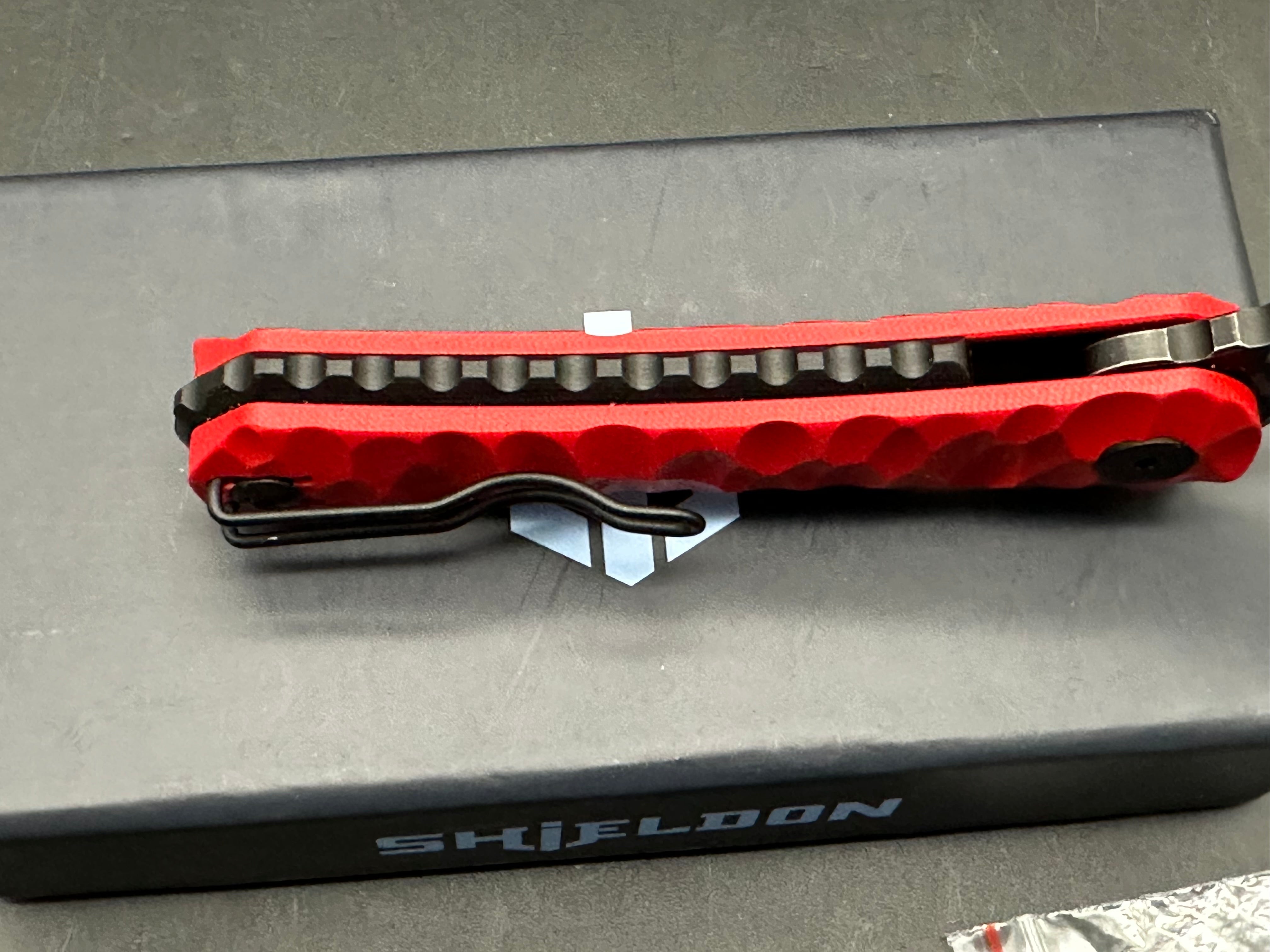 Shieldon Blades Scythe XL folder Blackwash Titanium coated blade of 154CM Red G10 Handle