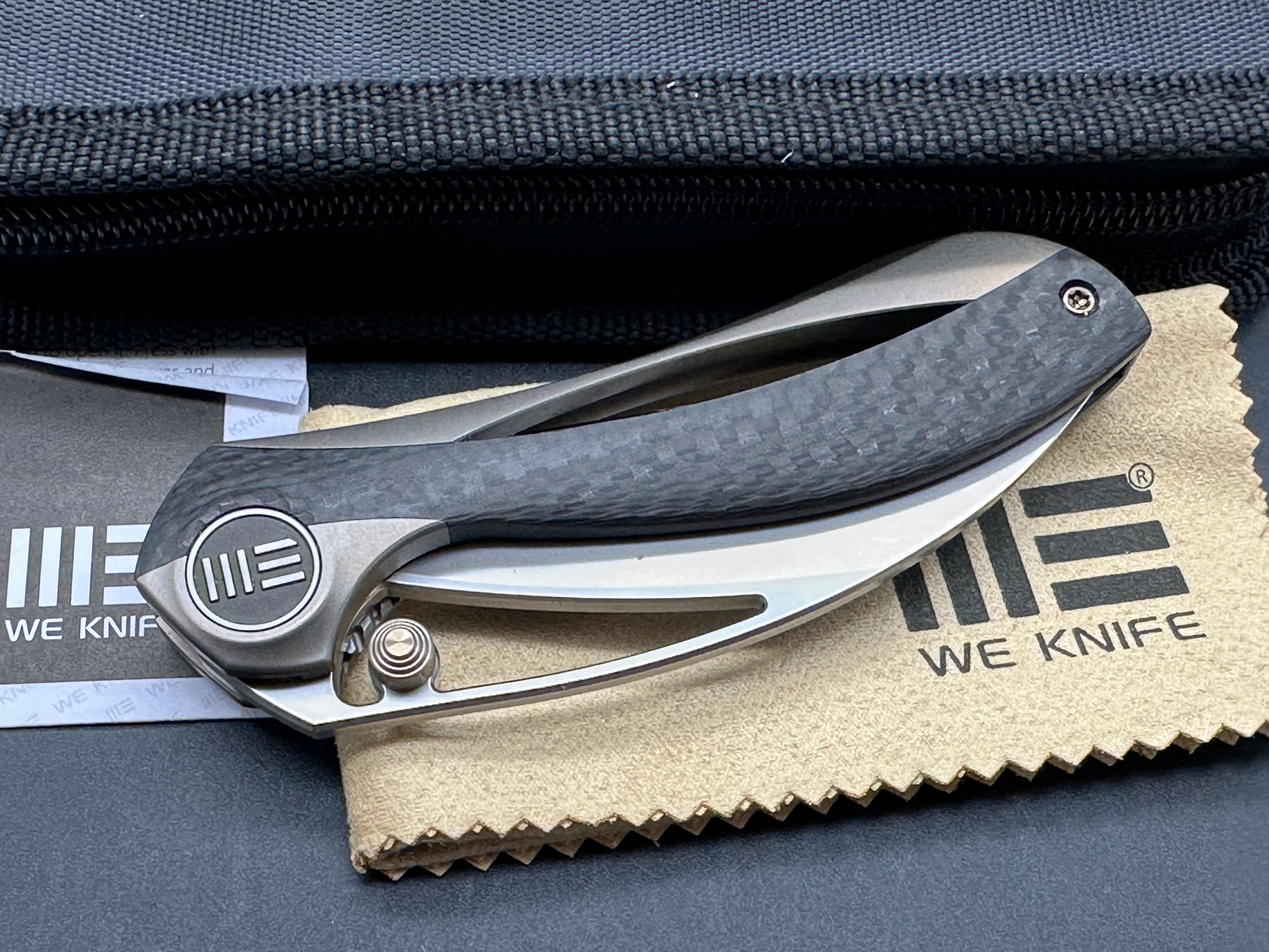 We Pleroma: Elijah Isham design. 2.95 inch M390 Carbon fiber and integral champagne titanium handle