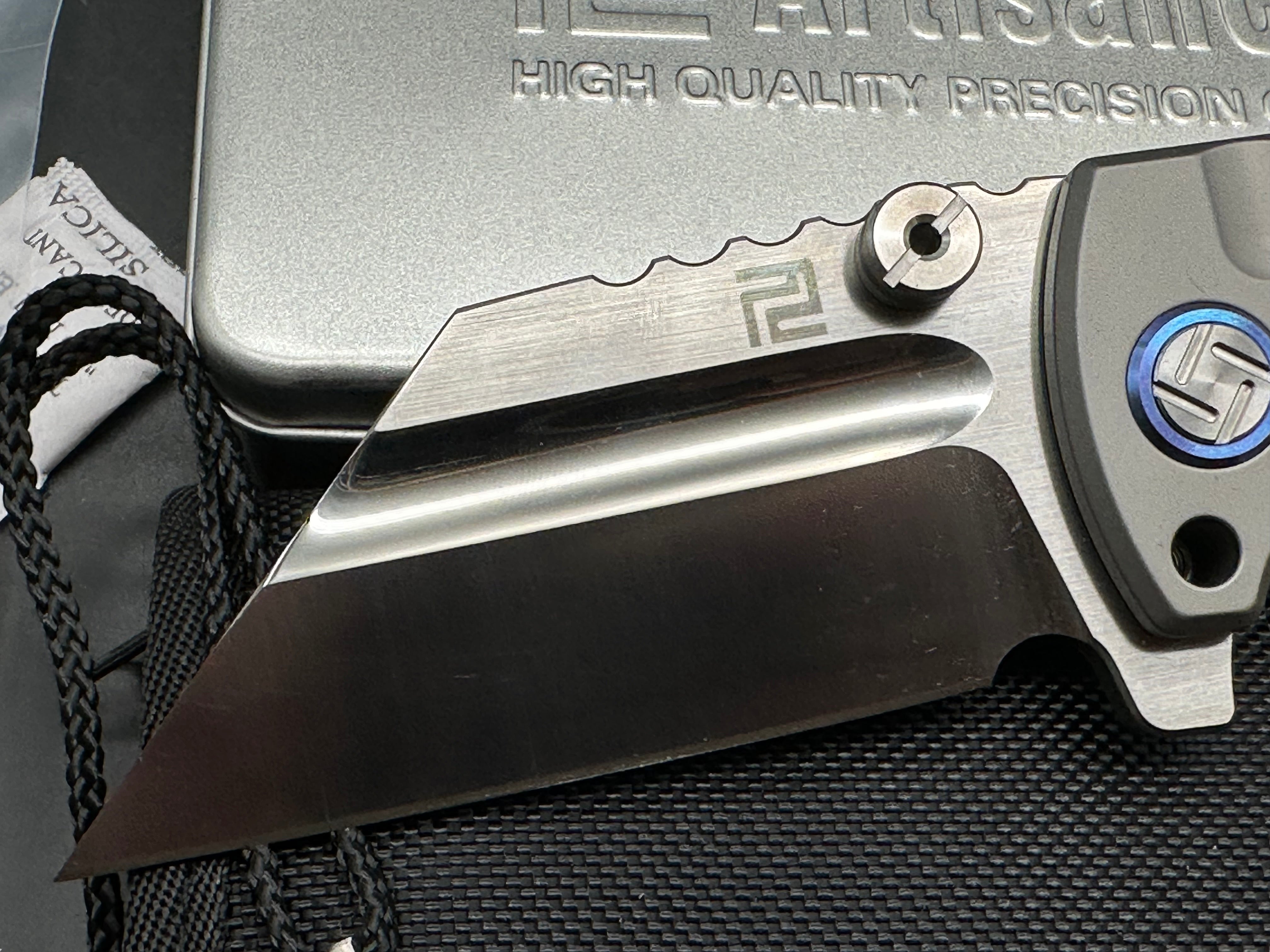 Artisan Cutlery Proponent: 3.85 inch, satin flat grind, s35VN Wharncliffe blade. Frame lock. Titanium handle