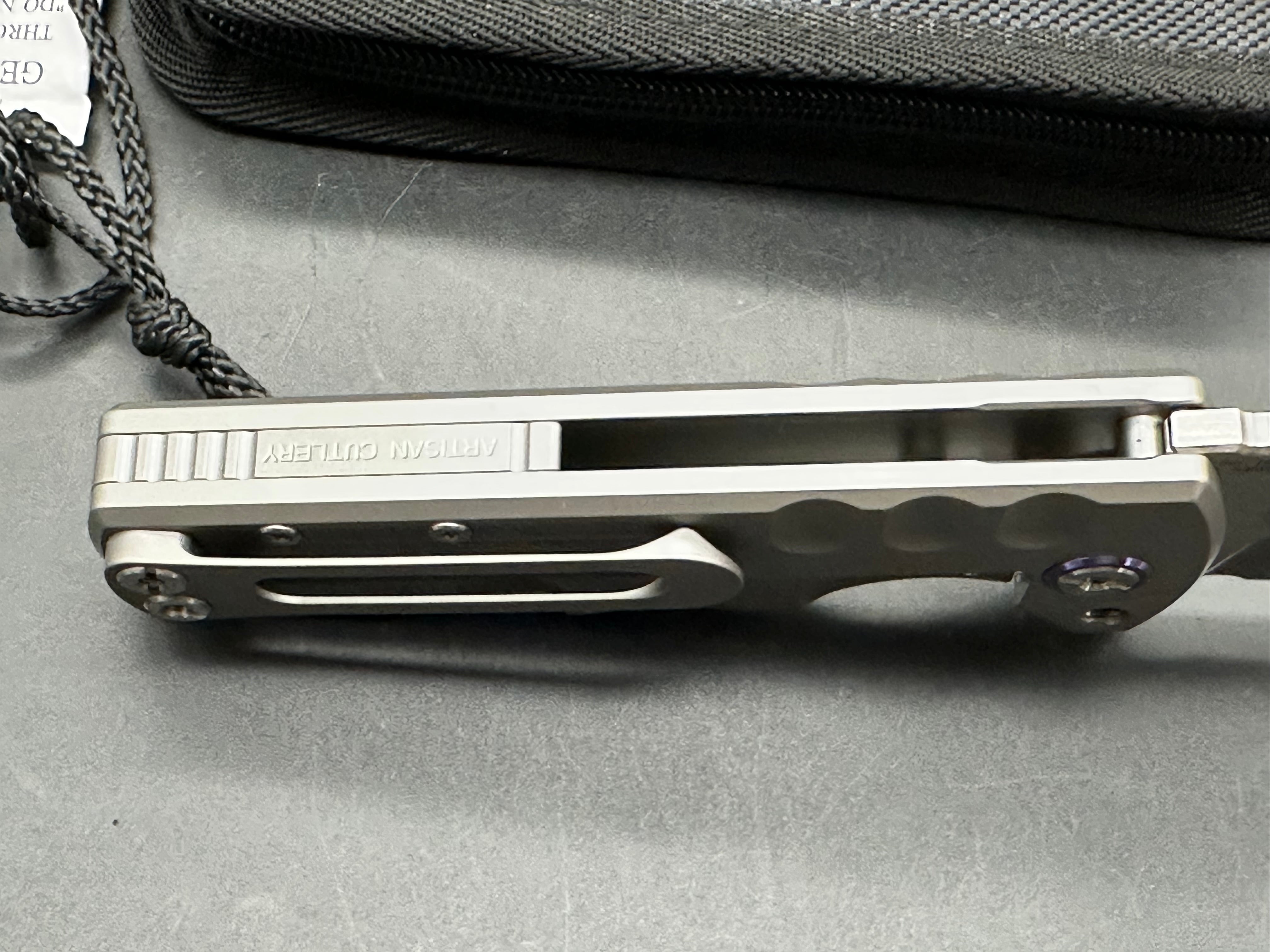 Artisan Cutlery Proponent: 3.85 inch, satin flat grind, s35VN Wharncliffe blade. Frame lock. Titanium handle