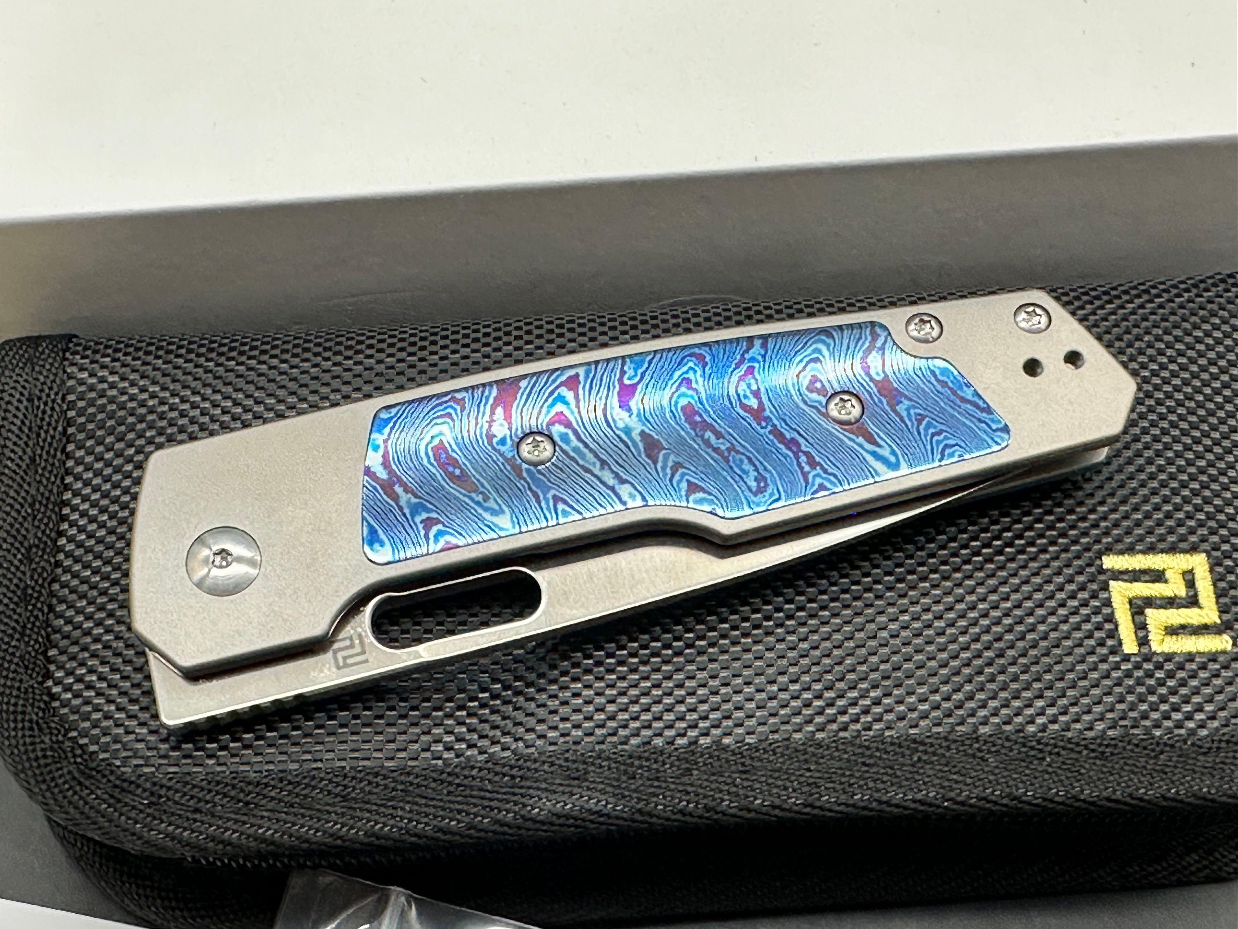 Artisan Cutlery The Queen's Gambit: Ray Laconico design. 3.5 inch CPM. S90v, sand polished drop point blade. Titanium and Timascus inlay handles