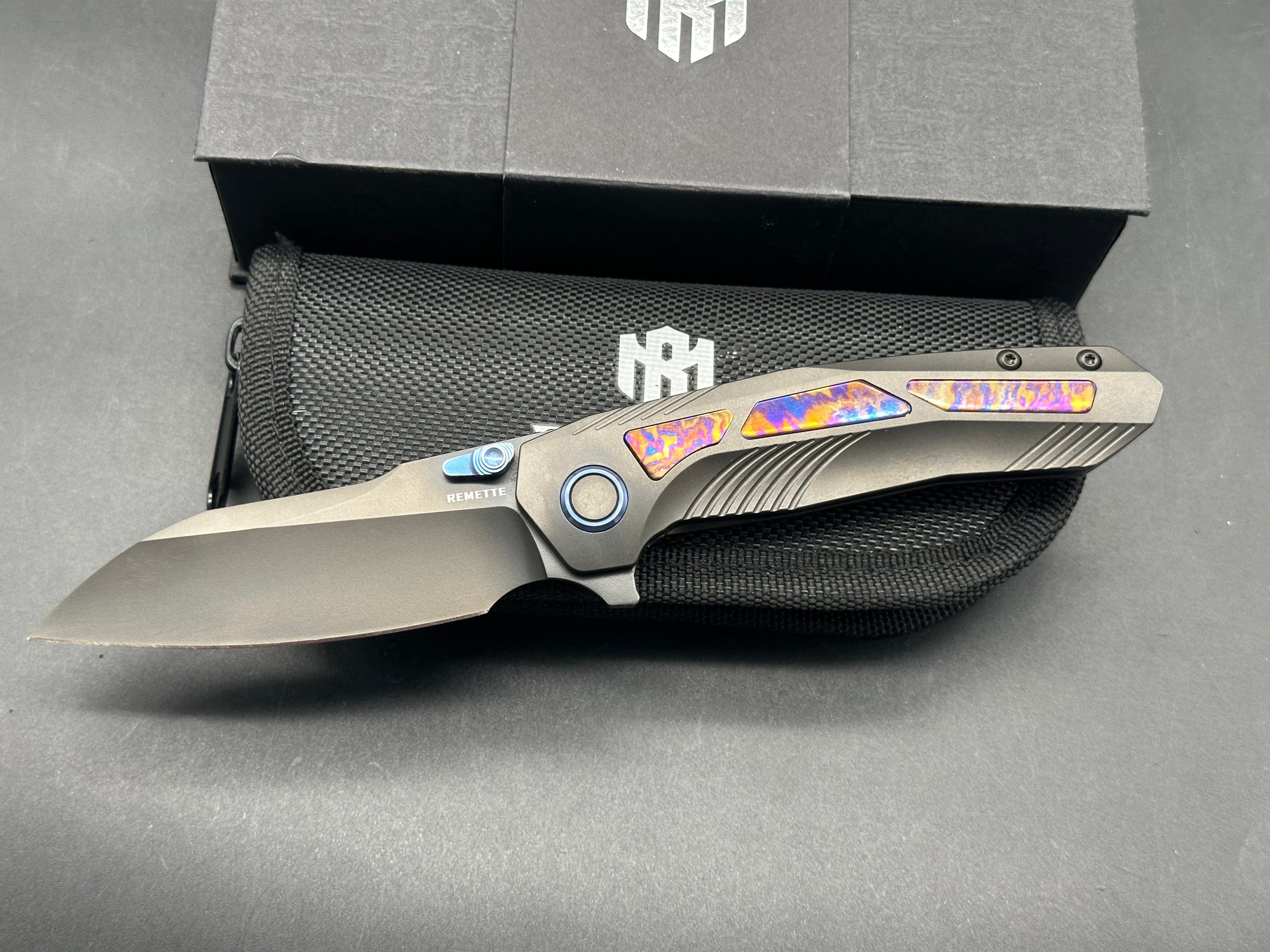Remette RT-Kestrel with DLC titanium scales with Timascus inlay and clip. DLC S35vn blade