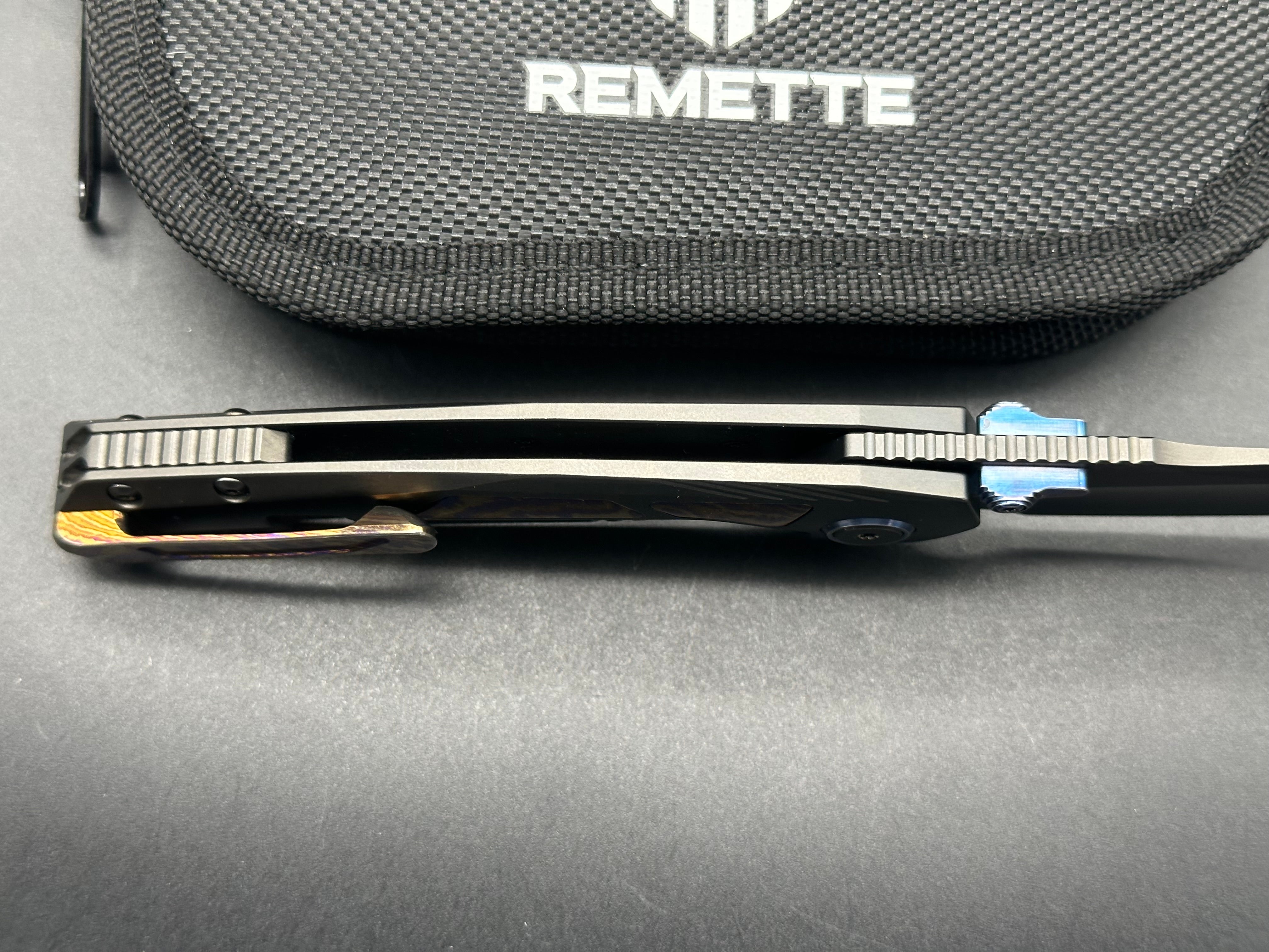 Remette RT-Kestrel with DLC titanium scales with Timascus inlay and clip. DLC S35vn blade