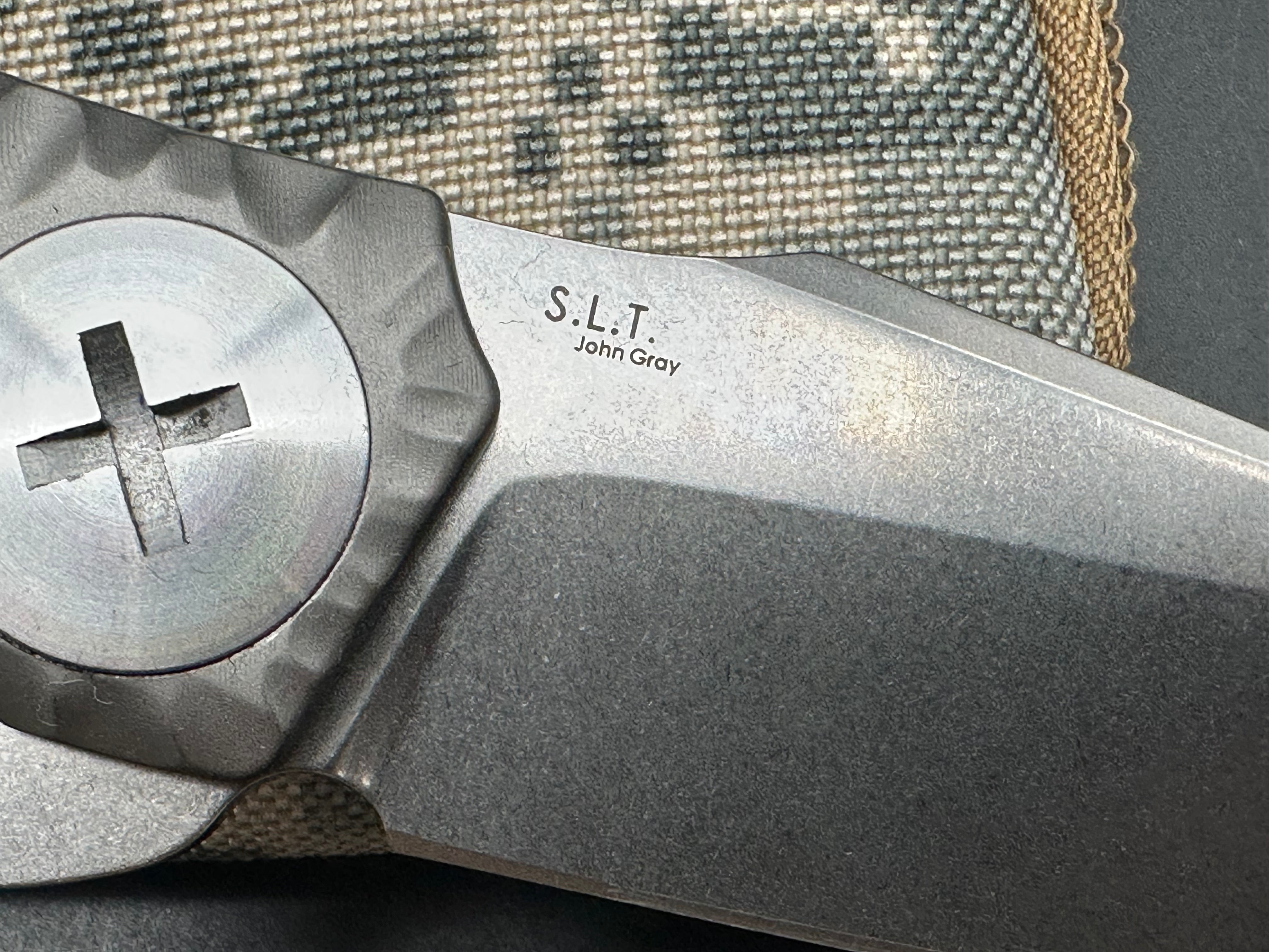 Kizer S.L.T.: John Gray design. 3.5 inch, hollow grind CPM-S35V blade. Frame lock. Titanium handle