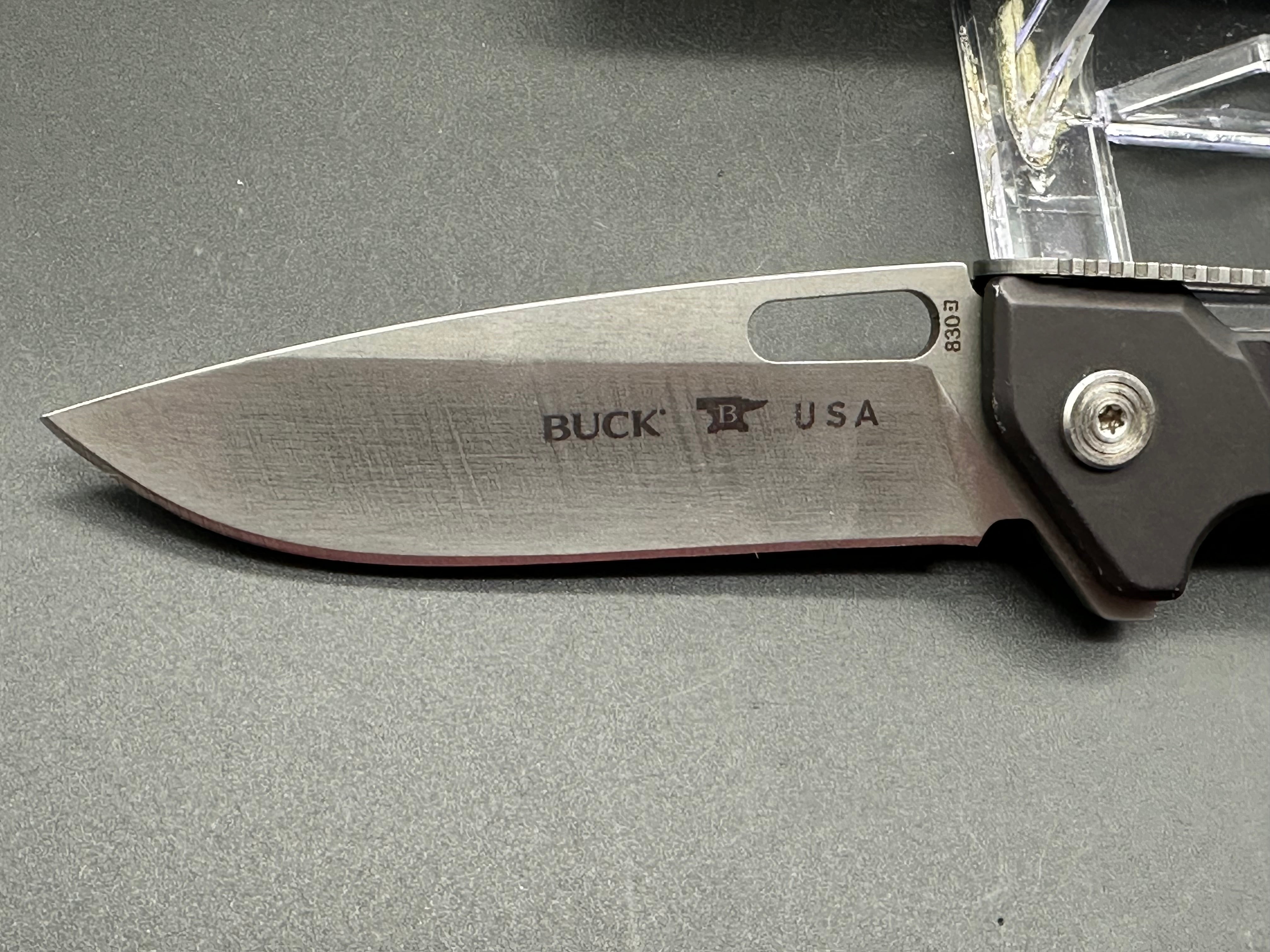 Buck 830 Marskman aluminum scales 154CM blade