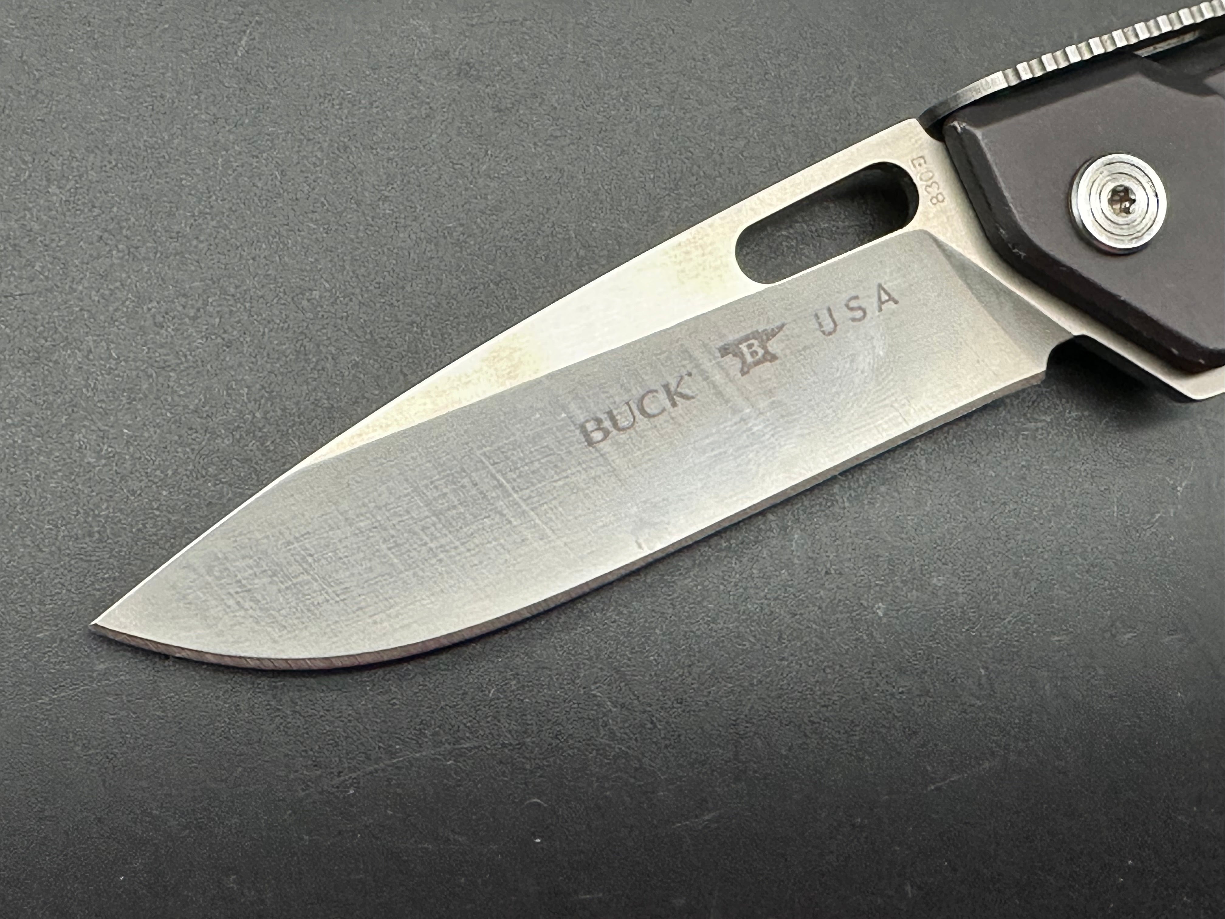 Buck 830 Marskman aluminum scales 154CM blade