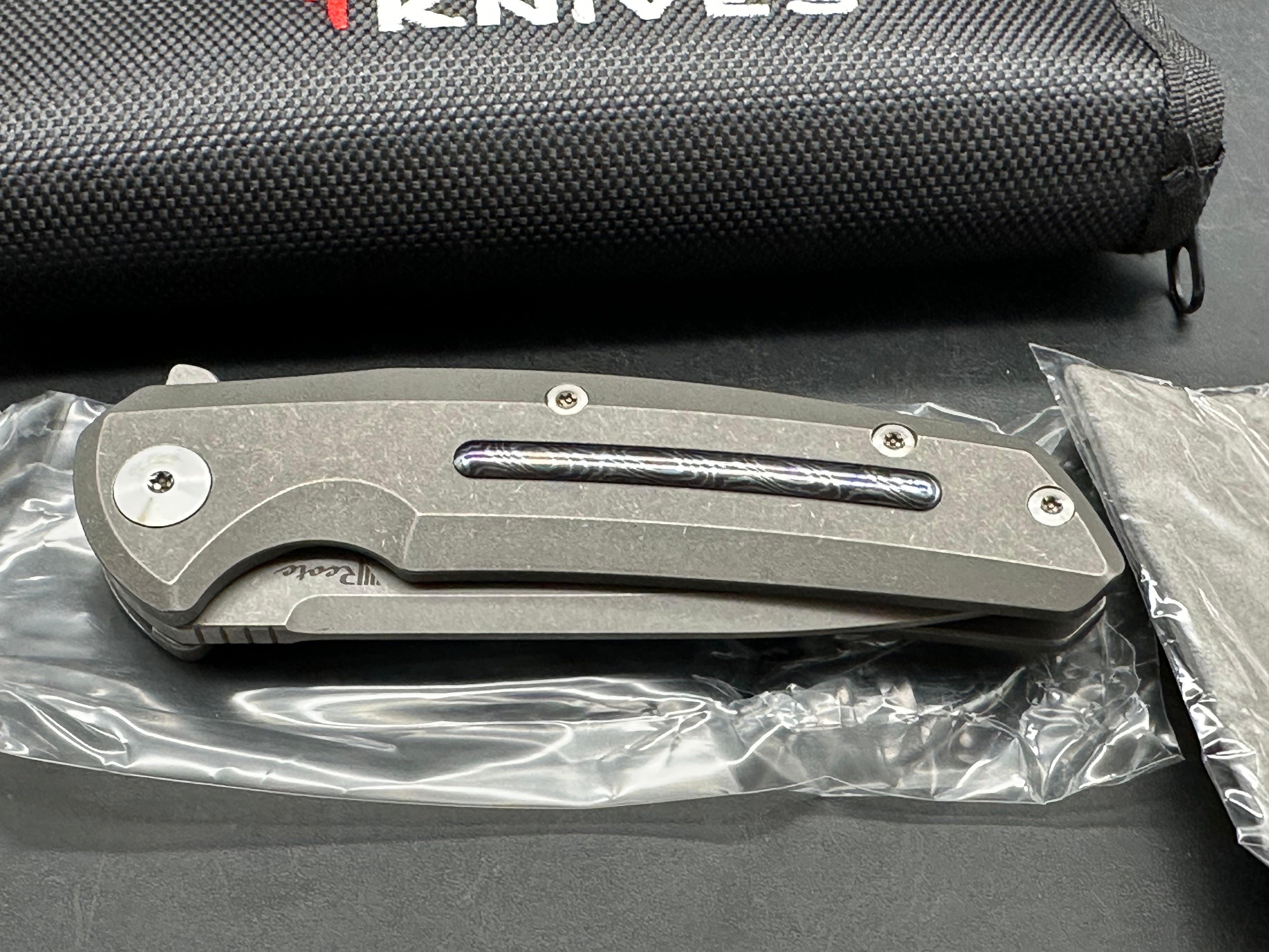 Reate Epoch: 3.75 inch CTS-204P drop point blade. Bead blasted titanium frame with Moku Ti inlay