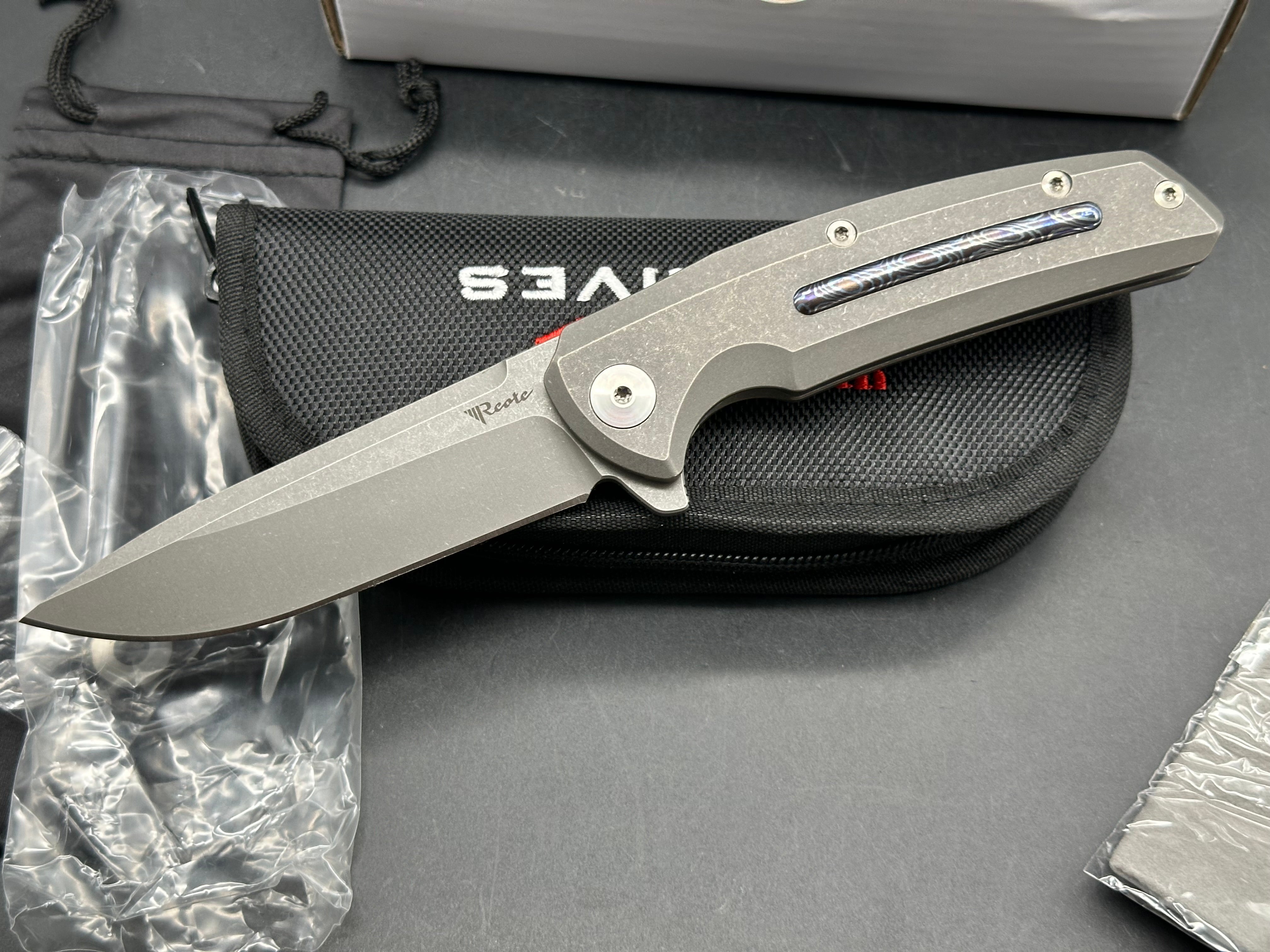 Reate Epoch: 3.75 inch CTS-204P drop point blade. Bead blasted titanium frame with Moku Ti inlay