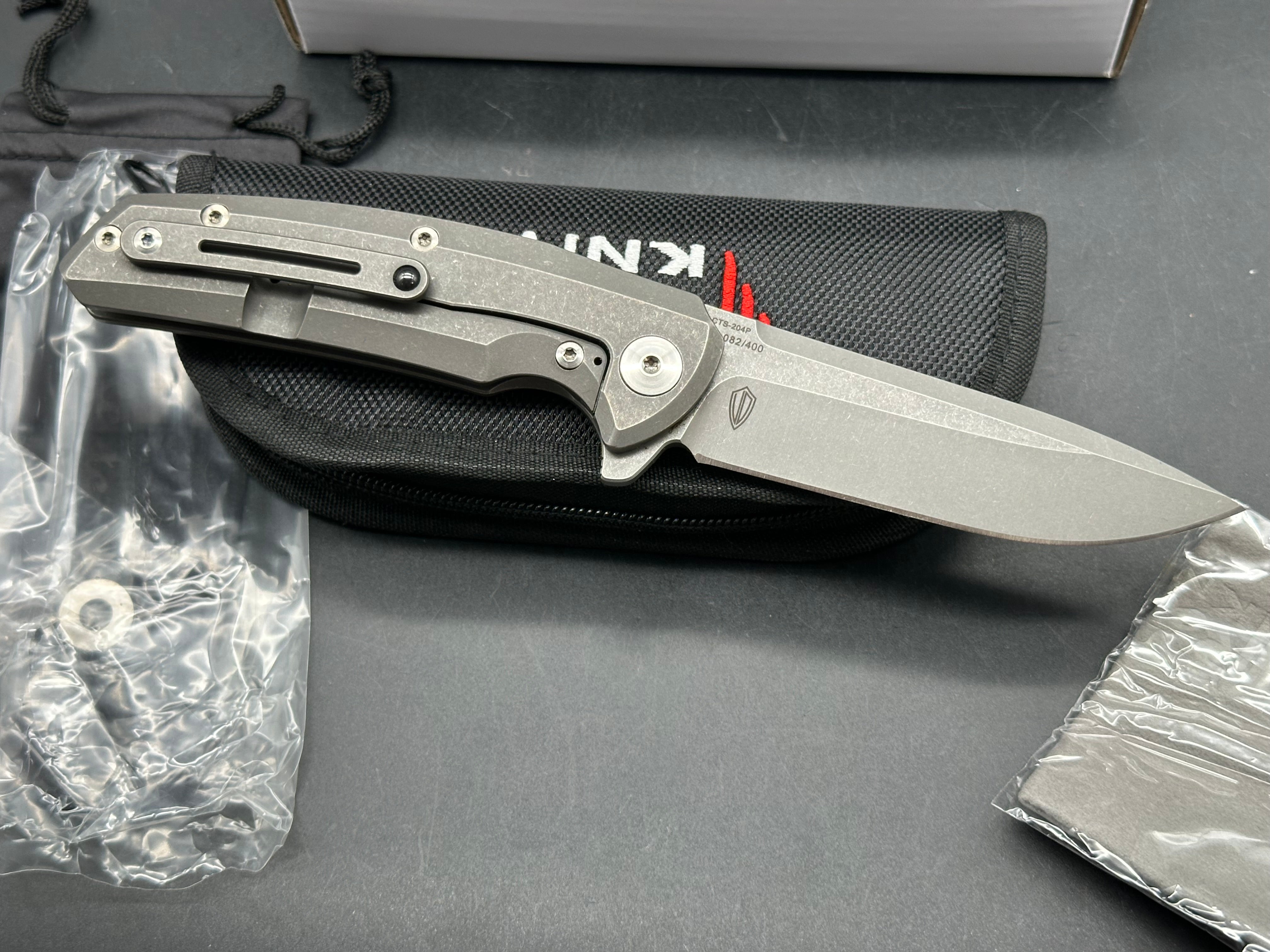 Reate Epoch: 3.75 inch CTS-204P drop point blade. Bead blasted titanium frame with Moku Ti inlay