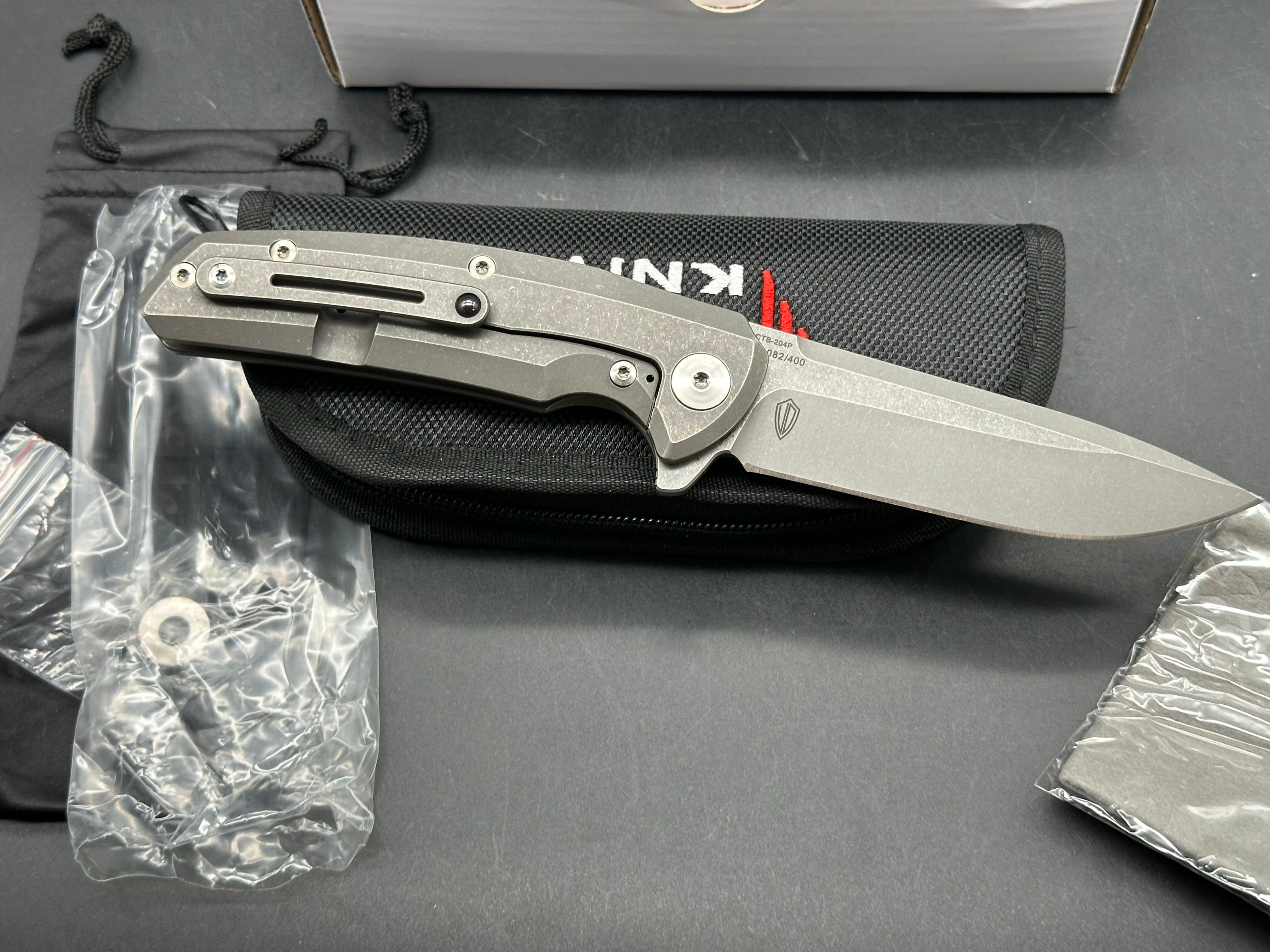 Reate Epoch: 3.75 inch CTS-204P drop point blade. Bead blasted titanium frame with Moku Ti inlay