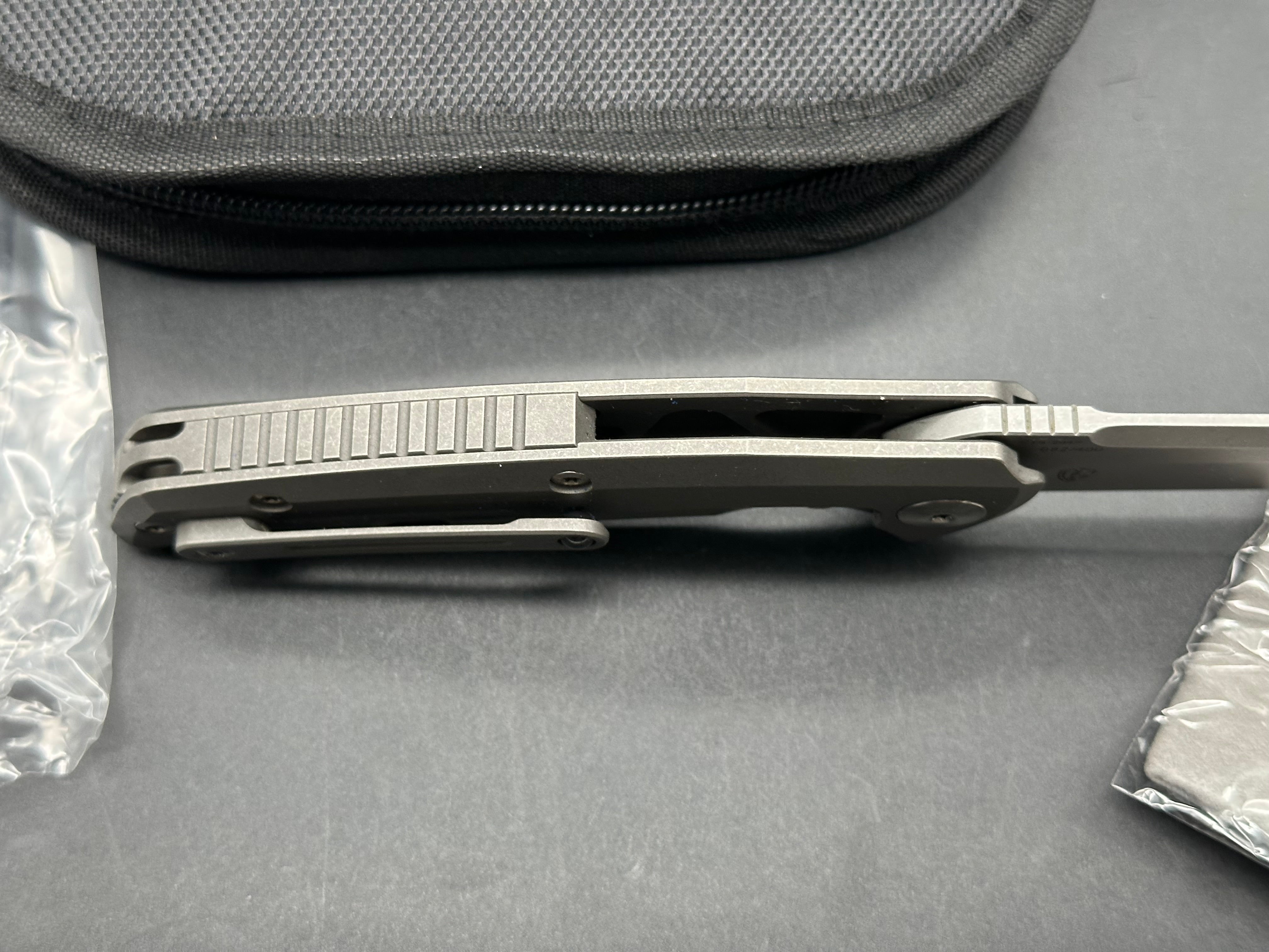 Reate Epoch: 3.75 inch CTS-204P drop point blade. Bead blasted titanium frame with Moku Ti inlay