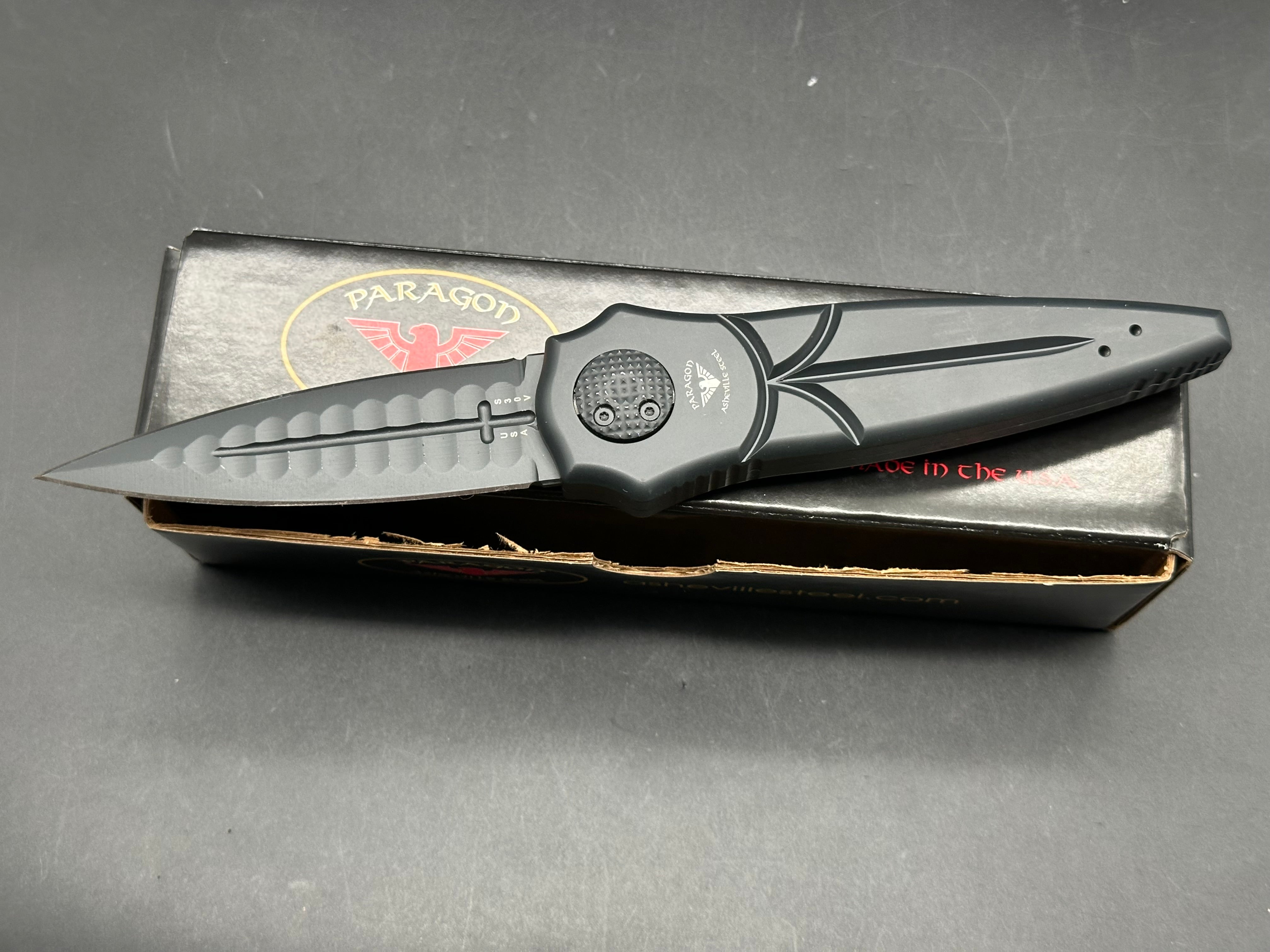 Paragon Warlock: 3.875 inch CPM-S30V blade with double edge. Double pus button split handle opener