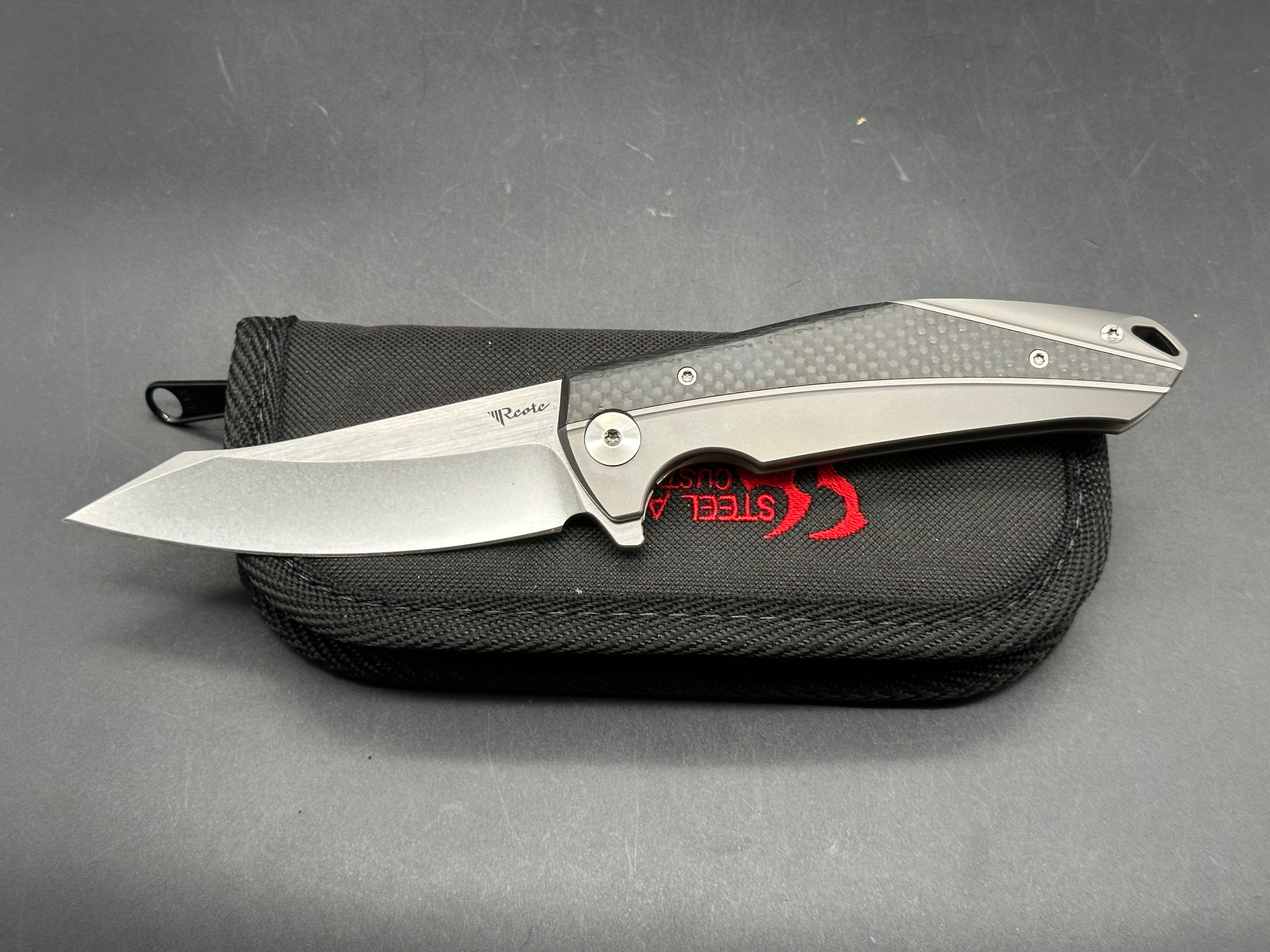 Reate K1: 3.875 inch RWL-34 blade. Steel overtravel stop. Titanium and carbon fiber handle