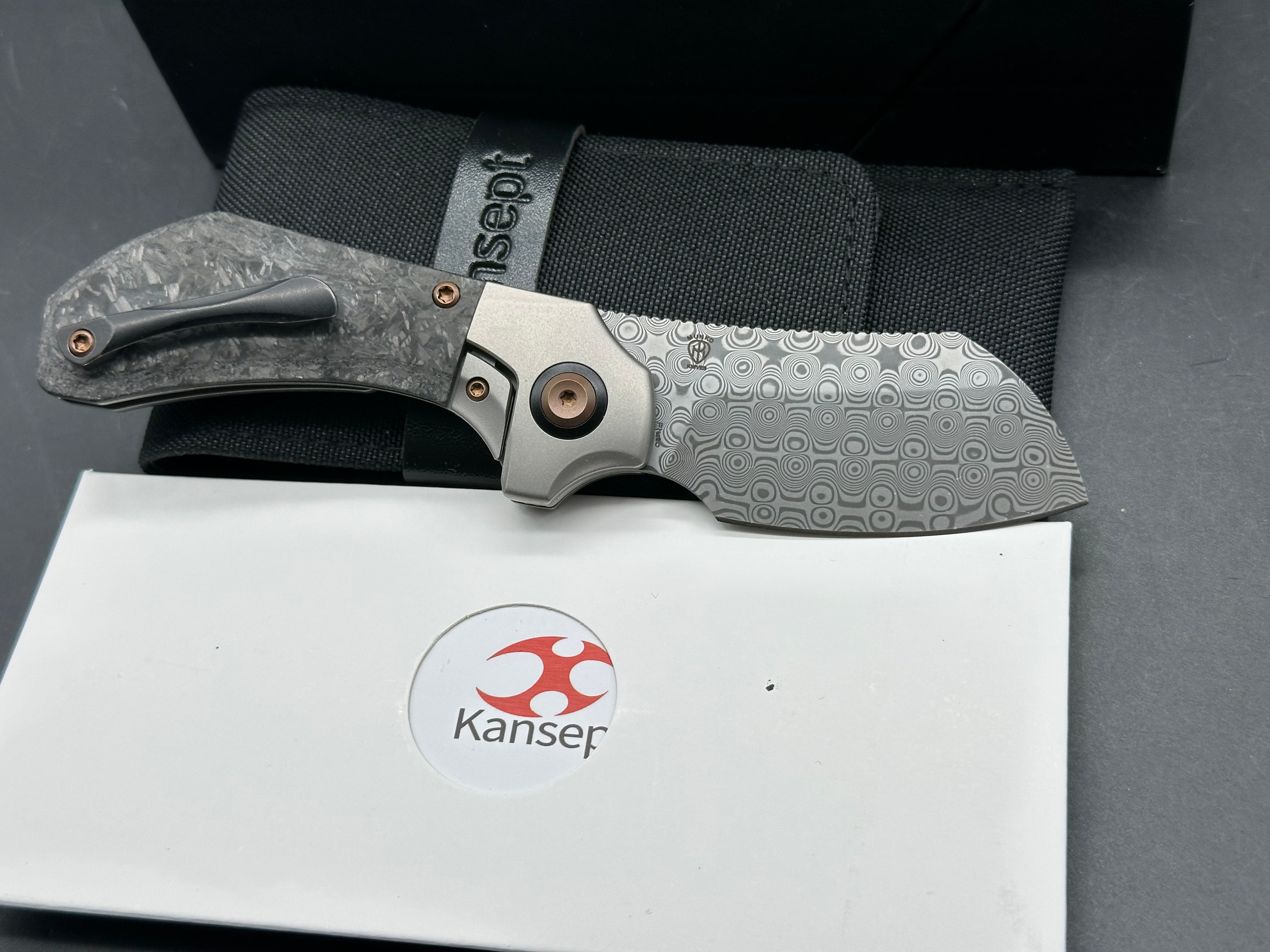 KANSEPT PLUTO FOLDING KNIFE STONEWASH TITANIUM/SHRED CARBON FIBER HANDLE DAMASCUS DROP POINT PLAIN EDGE