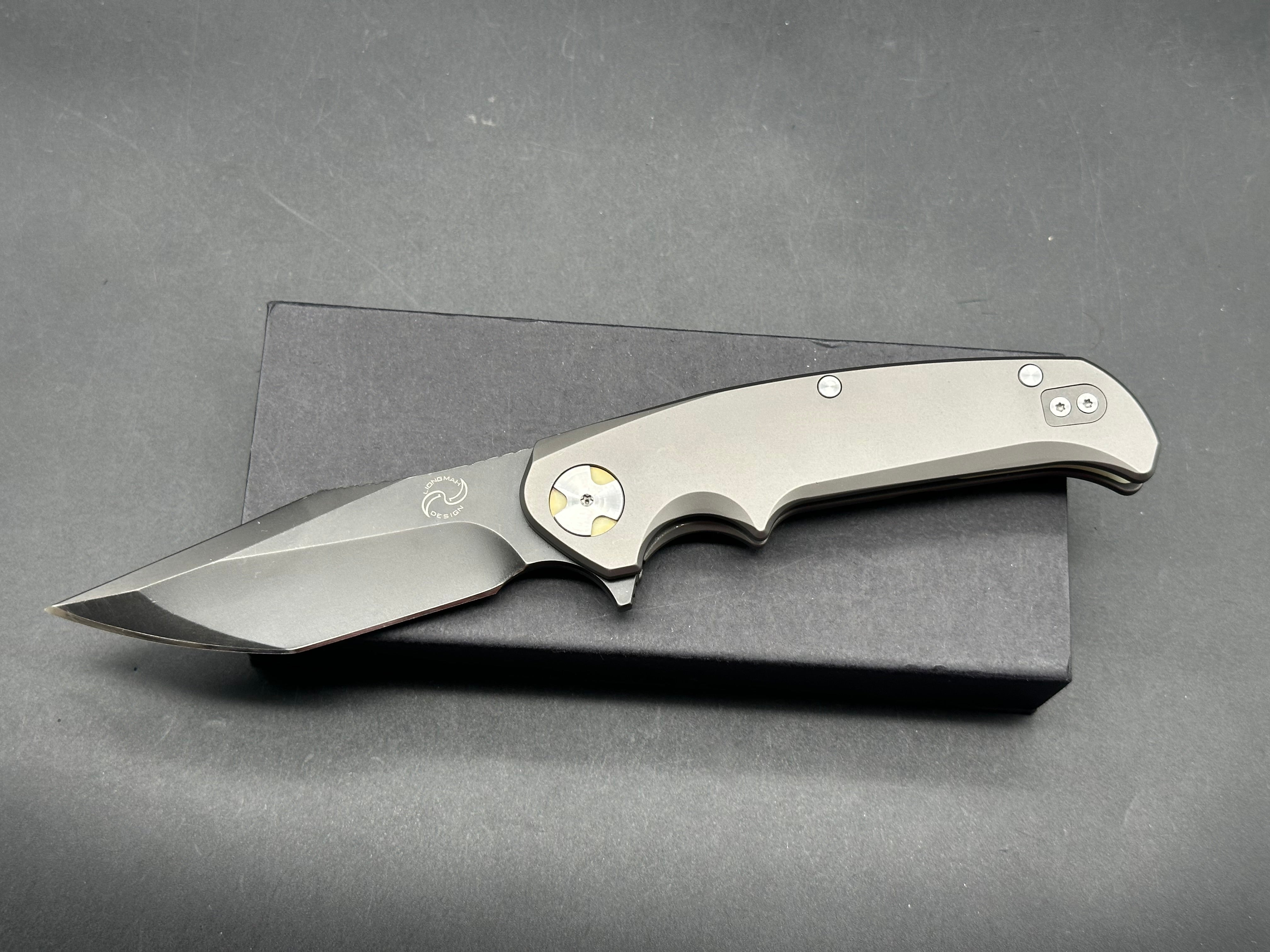 NUK from Liong Mah Designs stainless steel handles, moonglow inserts in the pivot and liners and D2 blade