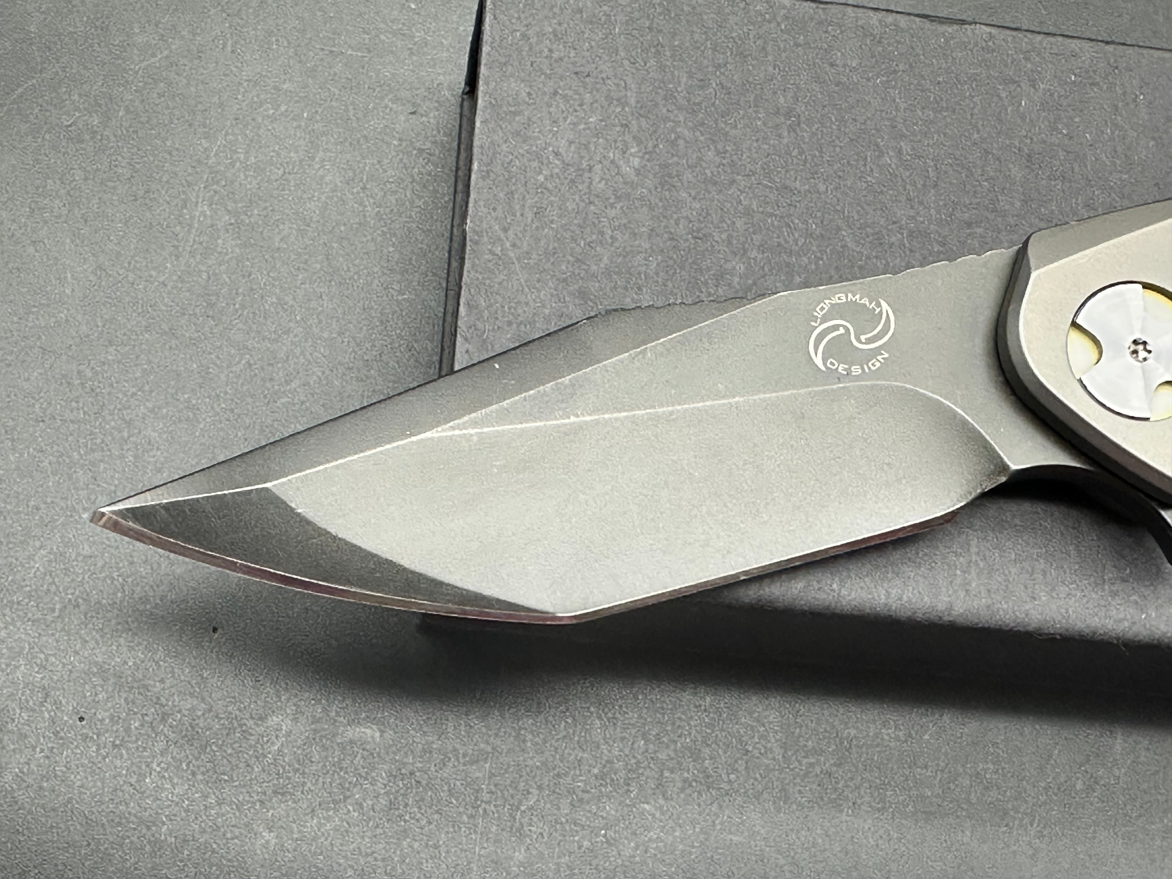NUK from Liong Mah Designs stainless steel handles, moonglow inserts in the pivot and liners and D2 blade
