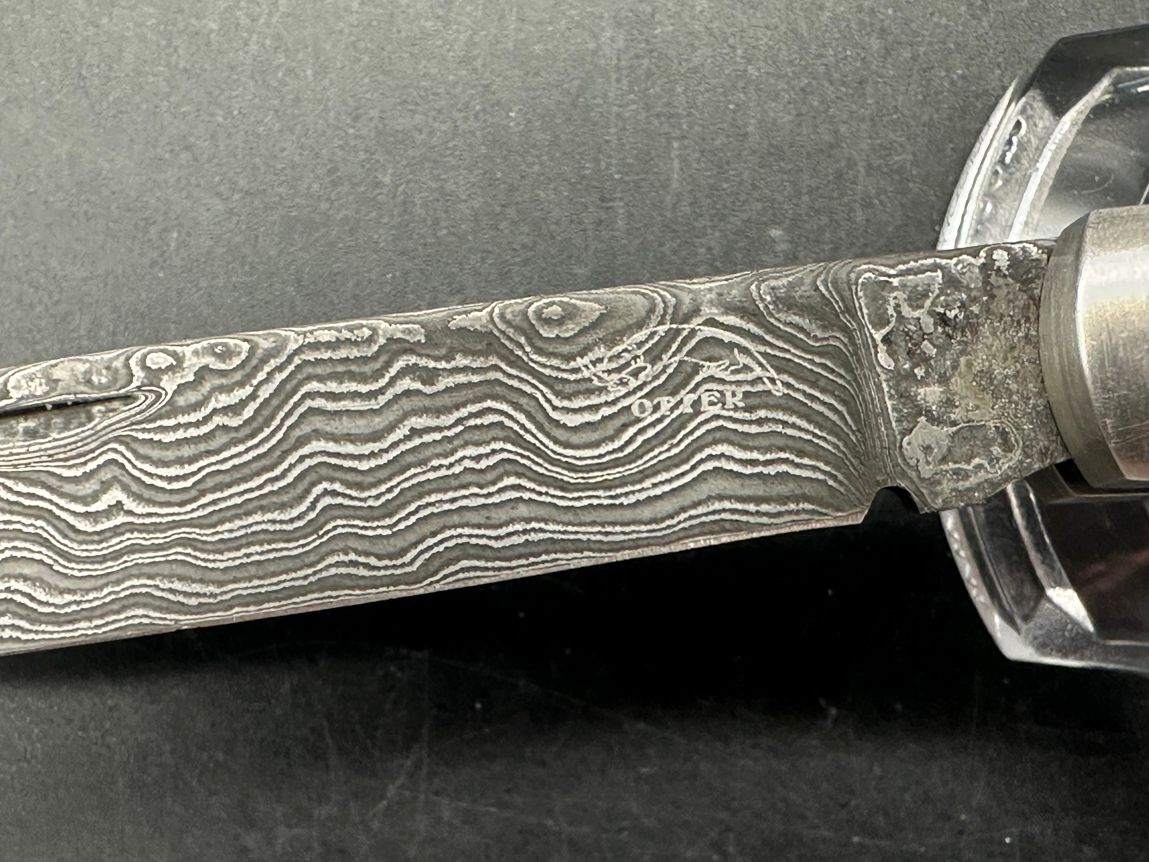 Otter Messer slipjoint with Damascus. Oak covers. 2.95 inch blade
